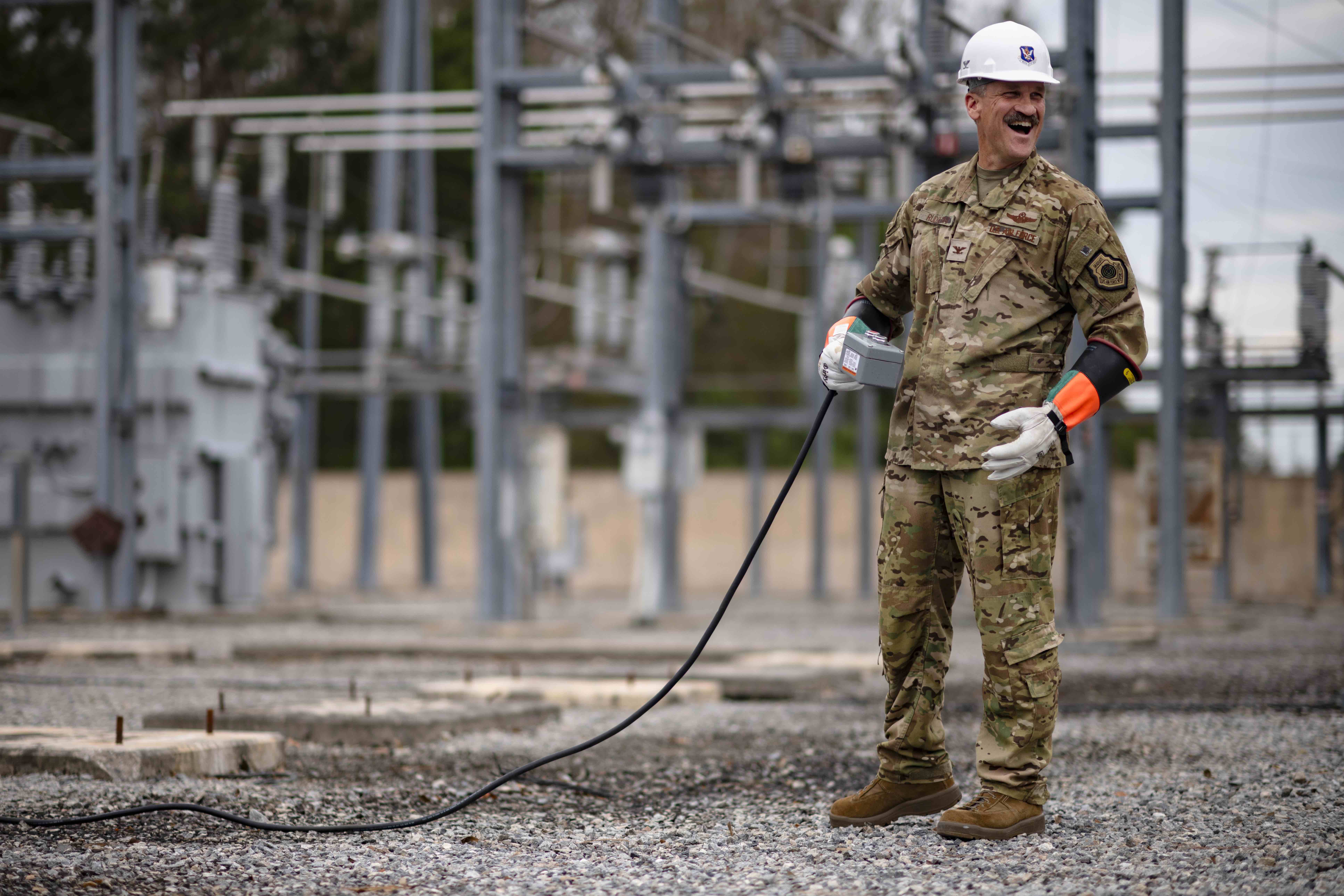 U.S. Air Force Col. Ben Rudolphi, 23rd Wing commander, energizes an electrical circuit to restore power to Moody Air Force Base, Georgia, after a power outage caused by Hurricane Helene, Oct. 1, 2024. Hurricane Helene resulted in power outages across Southern Georgia, leaving more than 100,000 people in Lowndes County without power. For four days, Airmen worked around the clock to restore power and clear the roads of debris. (U.S. Air Force photo by Tech. Sgt. Devin Boyer)