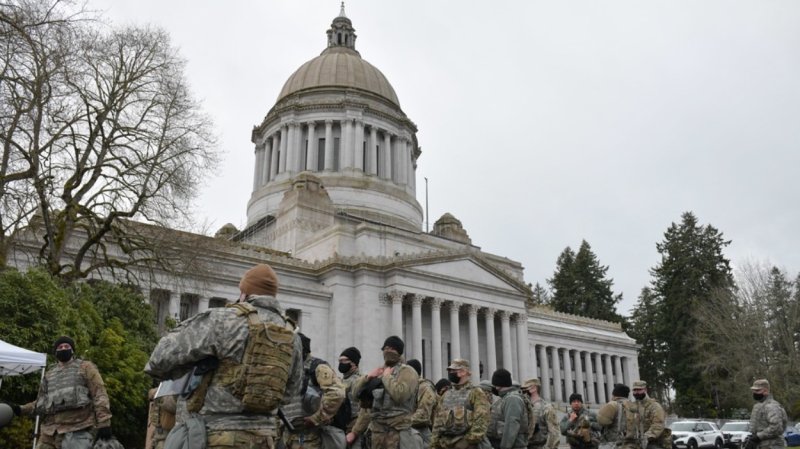 National Guard soldiers stand outside the Washington state capitol.