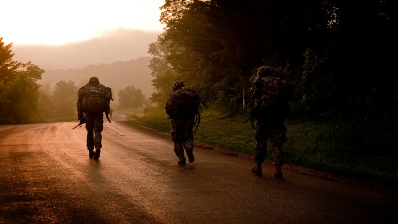 U.S. Army soldiers marching at dusk