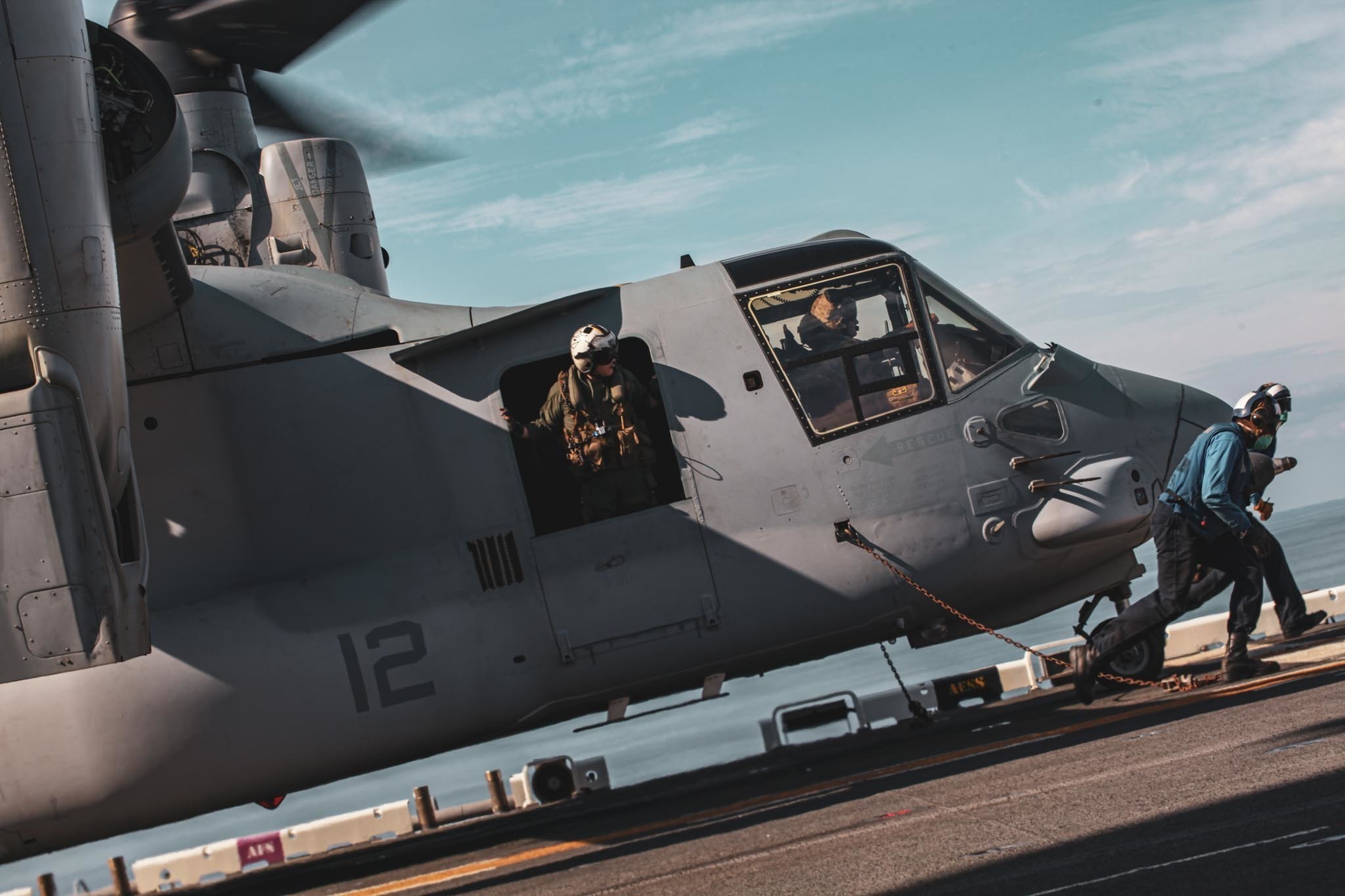 An MV-22 Osprey prepares for takeoff during integration training between Amphibious Squadron (PHIBRON) 4 and 24th Marine Expeditionary Unit (MEU) aboard the USS Iwo Jima on Oct. 28, 2020. PHIBRON-MEU Integration Exercise (PMINT) provides opportunities for Sailors and Marines to synchronize capabilities as a Navy-Marine Corps team. (U.S. Marine Corps photo by Cpl. Isaiah Campbell)