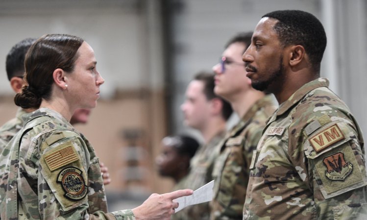 Maj. Caitlin Oviatt, 55th Logistics Readiness commander, inspects a shaving waiver during an open ranks inspection on July 9, 2024. Open ranks was being conducted as part of an Air Combat Command initiative to boost troop readiness. (U.S. Air Force photo by Chad Watkins)