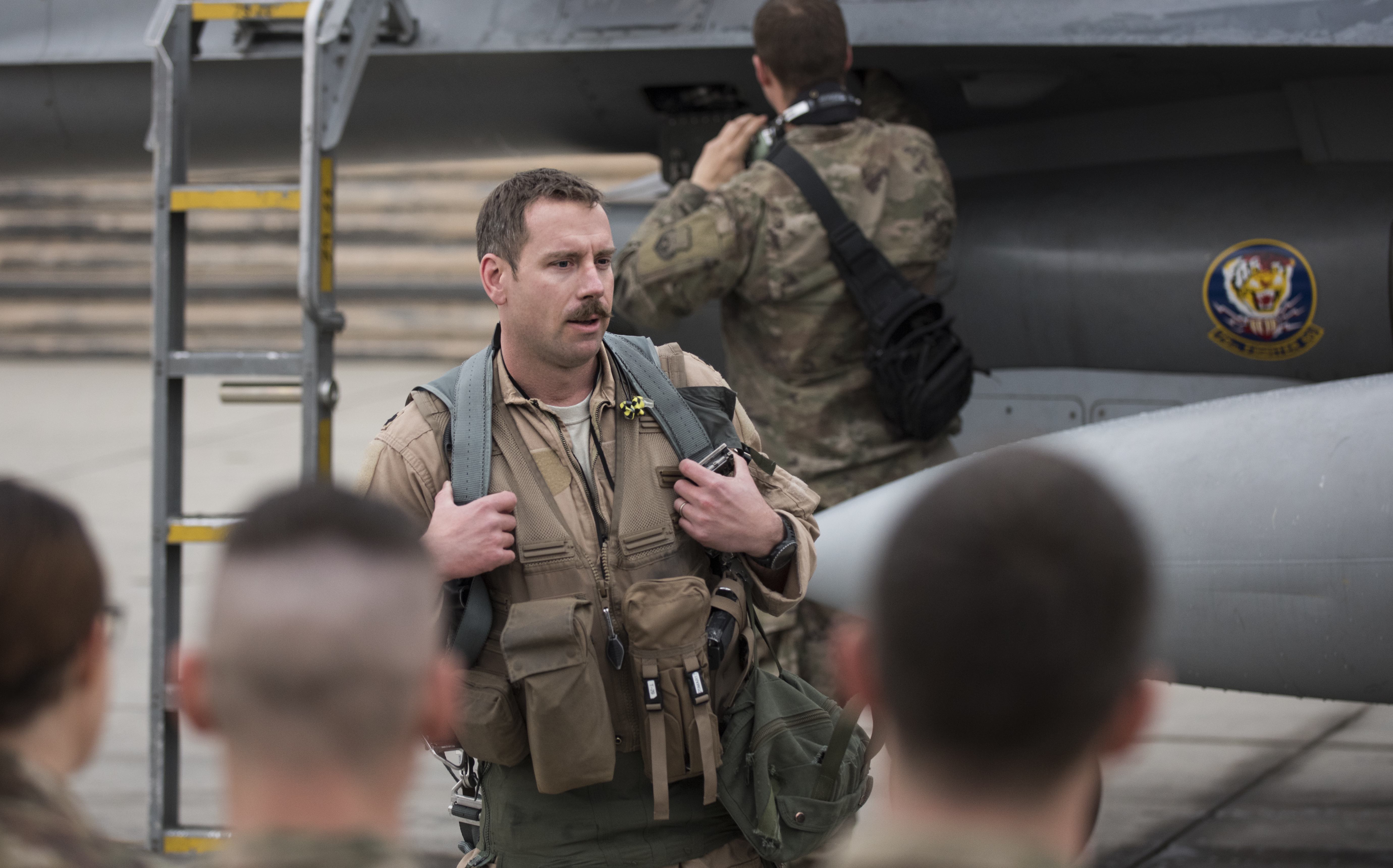 Lt. Col. Craig Andrle, 79th Expeditionary Fighter Squadron commander, speaks to squadron members after flying his 1,000th combat hour March 20, 2017 at Bagram Airfield, Afghanistan. There are only four F-16 Fighting Falcon pilots, lieutenant colonel and below, currently serving in the Air Force who have reached 1,000 combat hours. (U.S. Air Force photo by Staff Sgt. Katherine Spessa)