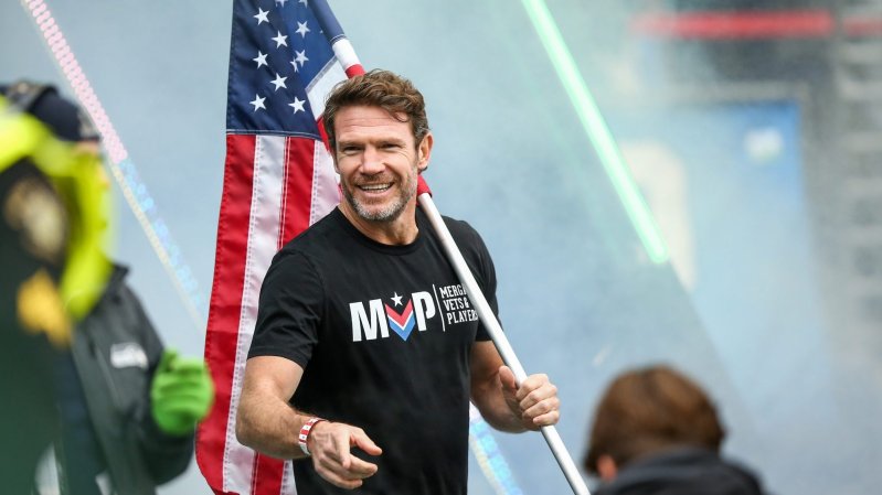 SEATTLE, WASHINGTON - OCTOBER 30: Former Seattle Seahawks player and United States Army Green Beret Nate Boyer prepares to run an American flag onto the field before the Salute to Service game between the Seattle Seahawks and the New York Giants at Lumen Field on October 30, 2022 in Seattle, Washington. The Seahawks beat the Giants 27-13. (Photo by Lindsey Wasson/Getty Images)