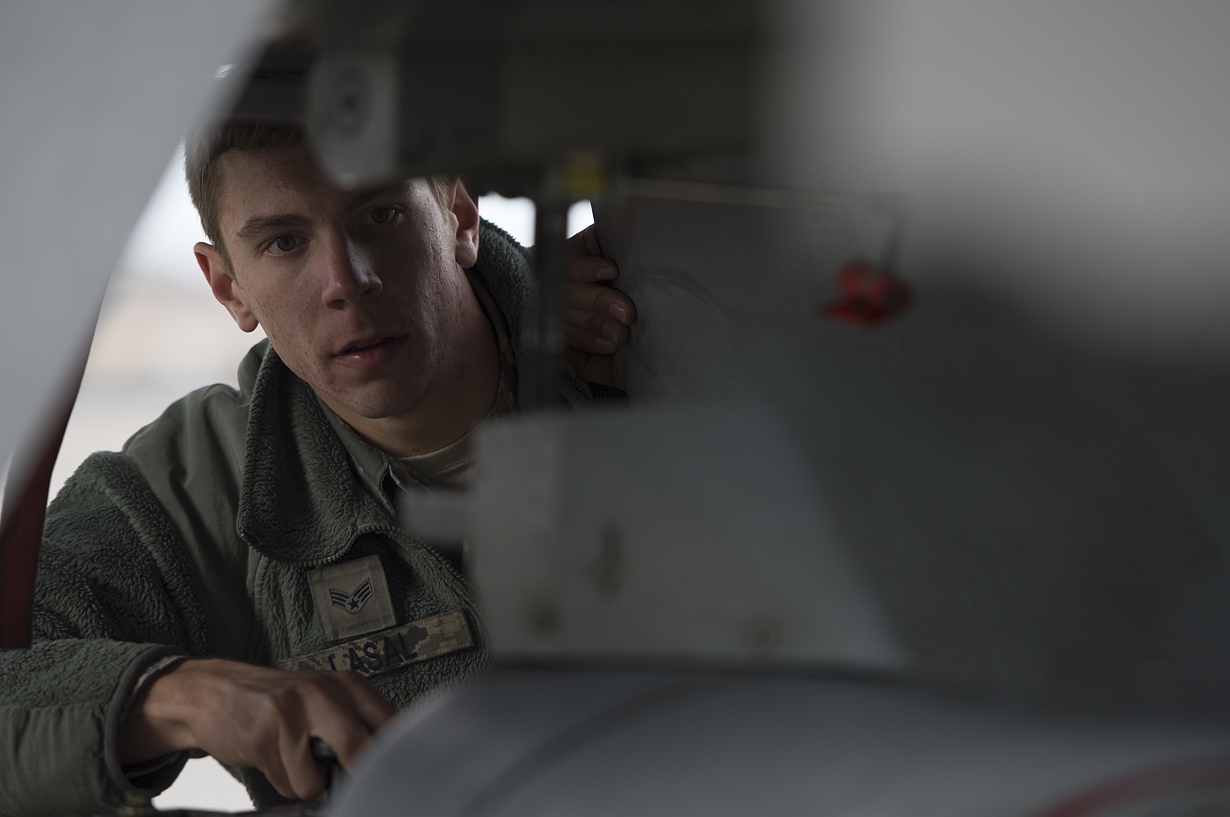 U.S. Air Force Senior Airman Daniel Lasal from the 20th Aircraft Maintenance Squadron, Shaw Air Force Base, S.C., performs maintenance on a F-16 Fighting Falcon during exercise Checkered Flag, Dec. 8, 2014, at Tyndall Air Force Base, Fla. (U.S. Air Force photo by Tech. Sgt. Jason Robertson/Released)