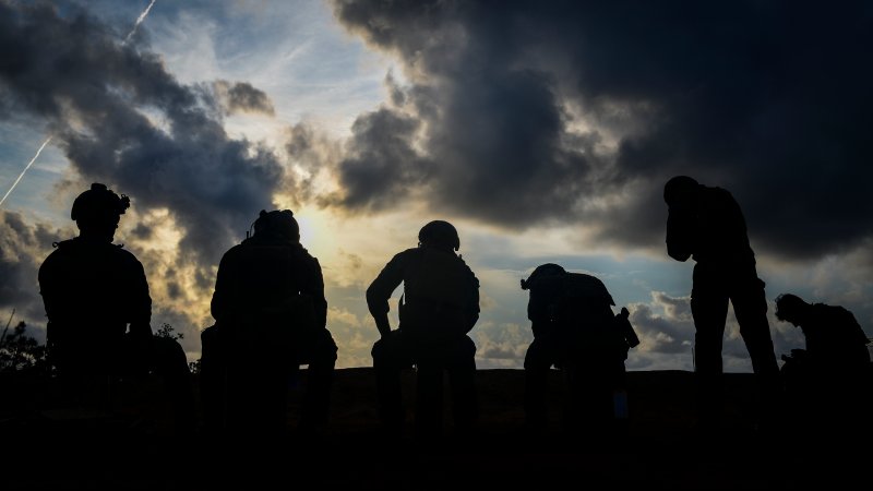 U.S. Marine Corps Raiders with 3rd Marine Raider Battalion take a break during training at Eglin Range, Fla., May 22, 2018. The 1st Special Operations Support Squadron Operations Support Joint Office coordinates two-week training programs for U.S. Army, Navy and Marine special operations forces that provides live-fire ranges and familiarizes them with Air Force Special Operations Command assets to ensure global readiness. (U.S. Air Force photo by Senior Airman Joseph Pick)