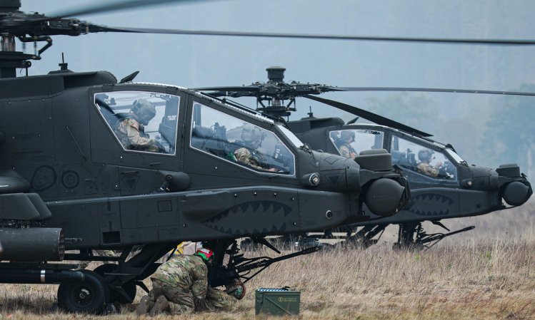 Soldiers assigned to 1-229 Attack Battalion, 16th Combat Aviation Brigade refuel, rearm, and repair AH-64E Apache attack helicopters and other vehicles at the Forward Arming and Refueling Point on Joint Base Lewis-McChord, Wash., Oct. 20, 2022. (U.S. Army photo by Sgt. Ashunteia' Smith)