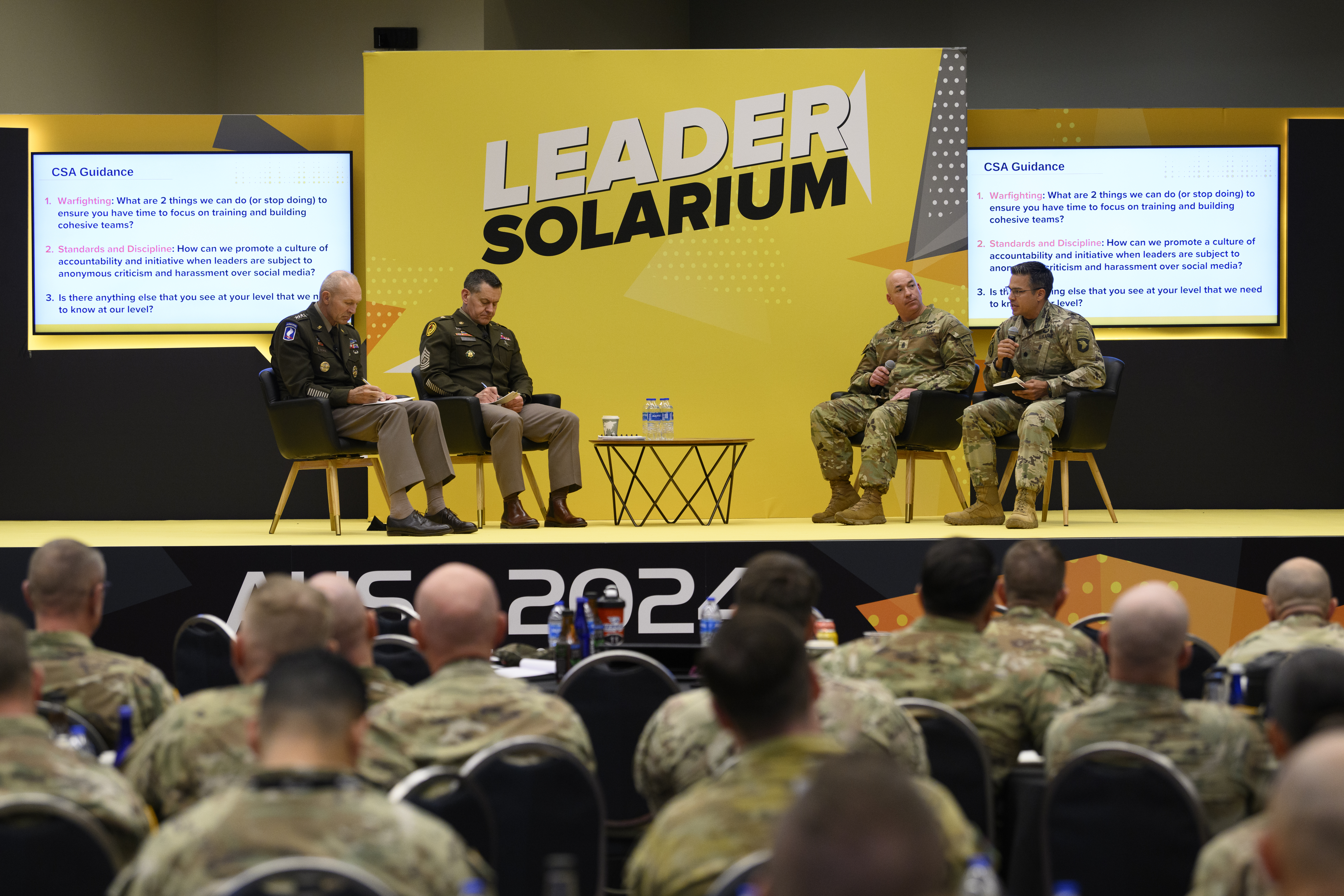 From left, Chief of Staff the Army Gen. Randy George and Sgt. Maj. of the Army Michael Weimer take notes at the Leader Solarium during the Association of the United States Army 2024 Annual Meeting and Exposition at the Walter E. Washington Convention Center in Washington, D.C., Oct. 16, 2024. The event gave a platform to battalion and brigade level leaders to bring up issues and recommendations to George and Weimer. (U.S. Army photo by Sgt. Daniel Hernandez)