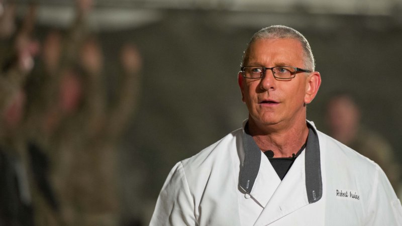 Chef Robert Irvine visiting troops overseas.