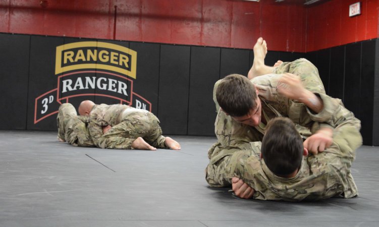 Sgt. Robert Love, 2nd Battalion, 75th Ranger Regiment, and Spc. Alexander Van Meter, 2nd Battalion, 75th Ranger Regiment, conduct combatives training, June 5, at Fort Benning, Ga. Love and Van Meter are preparing for the USASOC Best Warrior Competition. (U.S. Army photo by Pfc. Eric Overfelt/Released)