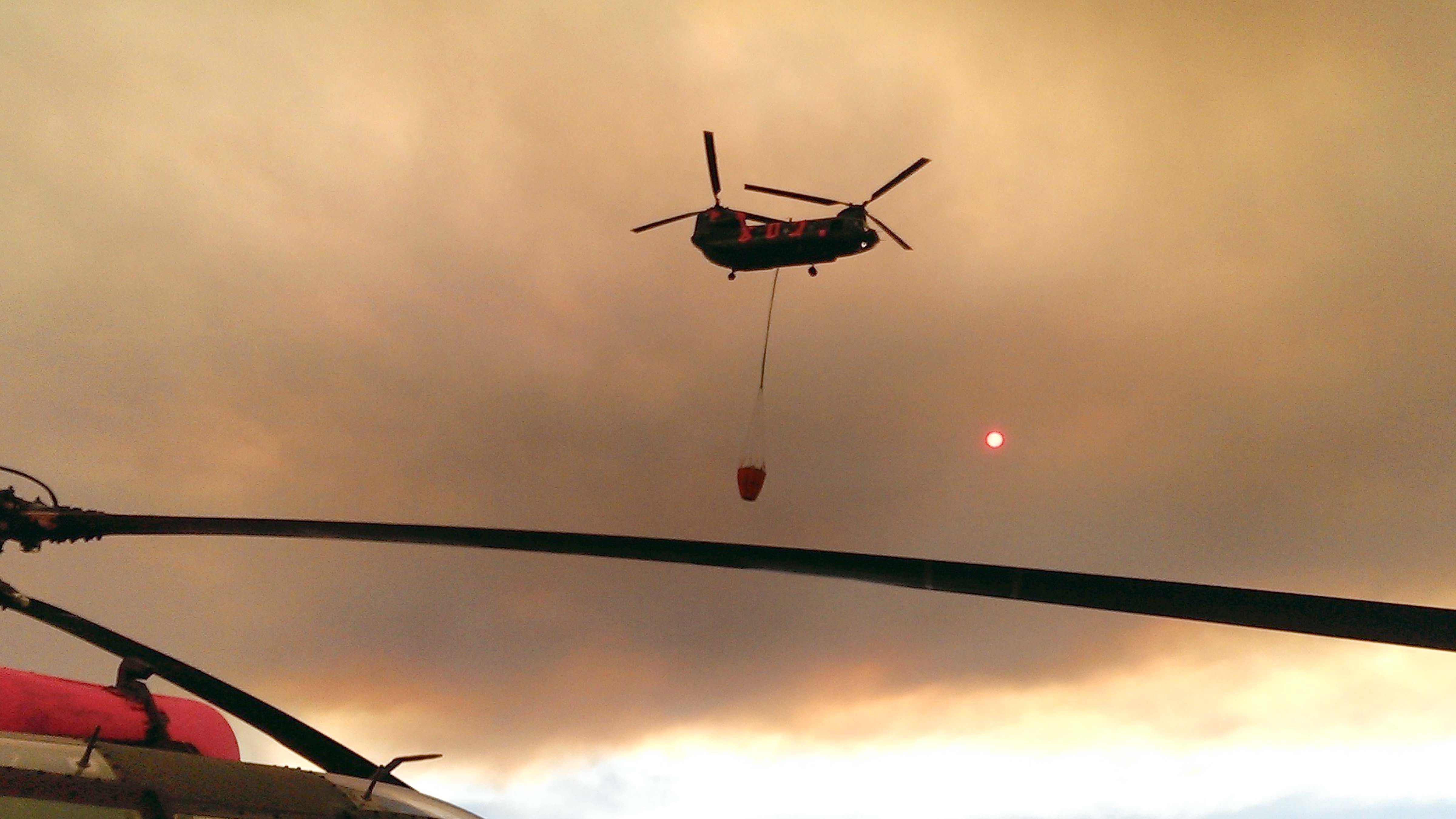 A California National Guard Chinook enroute to do a water drop on wildfires.