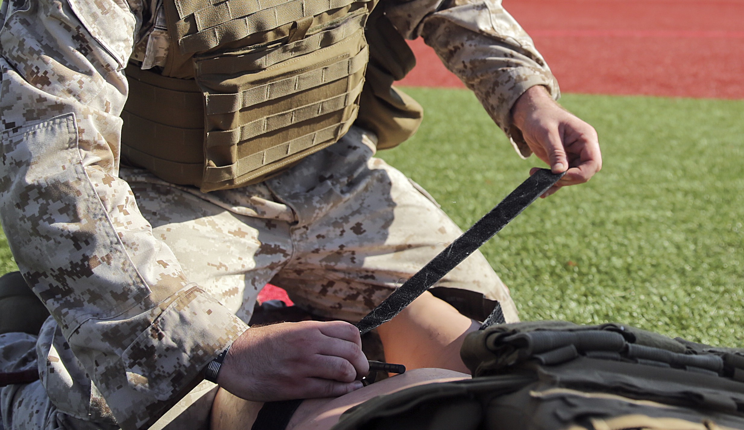 U.S. Marine Lance Cpl. Matthew Little an electrician with Special Purpose Marine Air-Ground Task Force Crisis Response-Africa, applies a tourniquet to a simulated casualty during a combat lifesaver course at Naval Air Station Sigonella, Italy, August 4, 2016. During the four-day course, Marines learned to recognize injuries, perform the appropriate procedures and control the patient to prolong survivability until help arrives. U.S. Marines and Sailors assigned to Special Purpose Marine Air-Ground Task Force-Crisis Response-Africa Command support operations, contingencies and security cooperation in the U.S. Africa Command area of responsibility. (U.S. Marine Corps photo by Cpl. Alexander Mitchell)