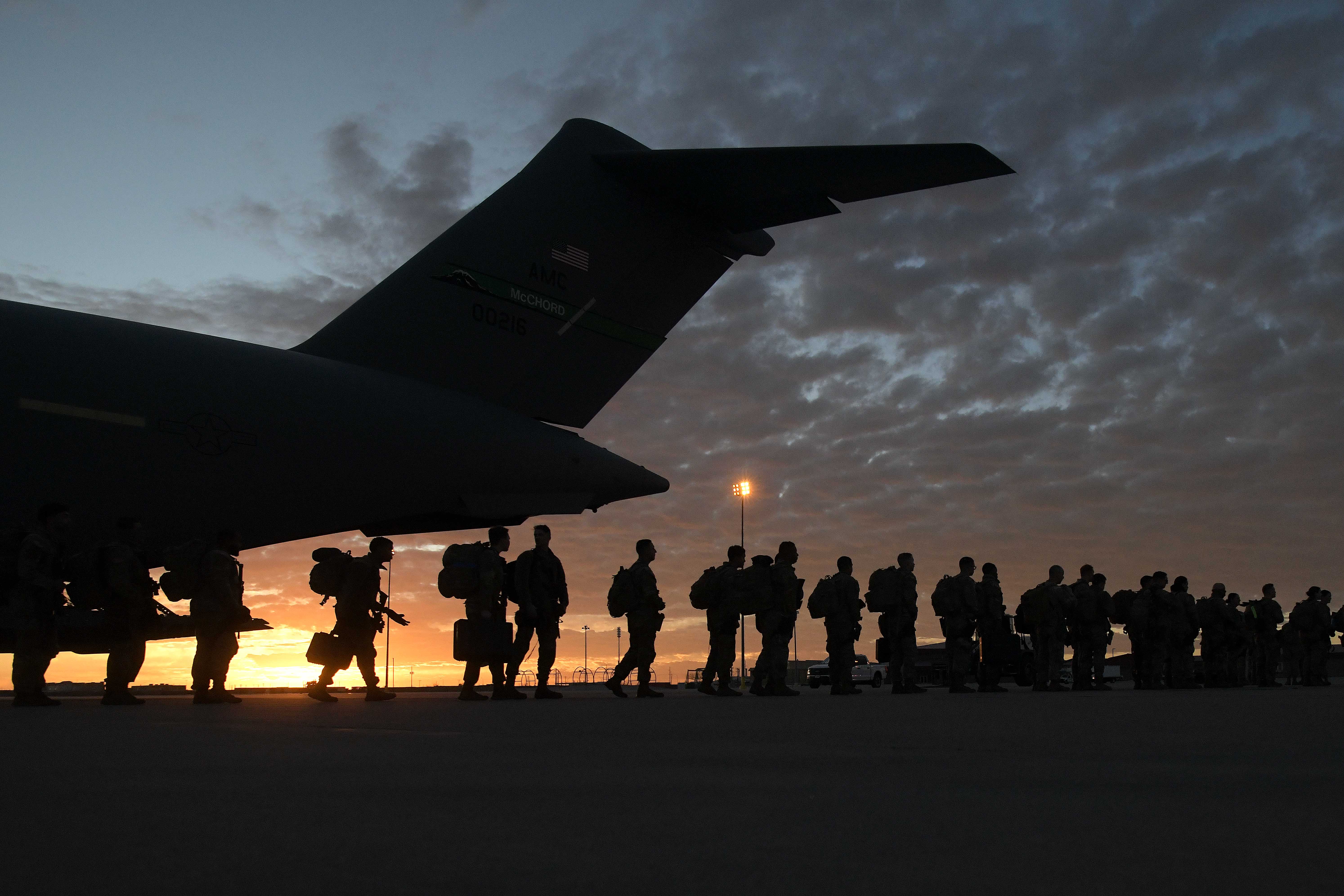 U.S. Soldiers with the 66th Military Police Company, based at Joint Base Lewis-McChord, Wash.,, exit a C-17 Globemaster III aircraft at Biggs Army Airfield, El Paso, Texas, as they deploy to the southern border in support of U.S. Northern Command, Jan. 25, 2025. U.S. Northern Command is working together with the Department of Homeland Security to augment U.S. Customs and Border Protection along the southern border with additional military forces. This initial deployment of 1,500 active-duty personnel brings the total military Title 10 forces along the border to nearly 4,000 personnel. (U.S. Army photo by Sgt. 1st Class Jon Soucy)