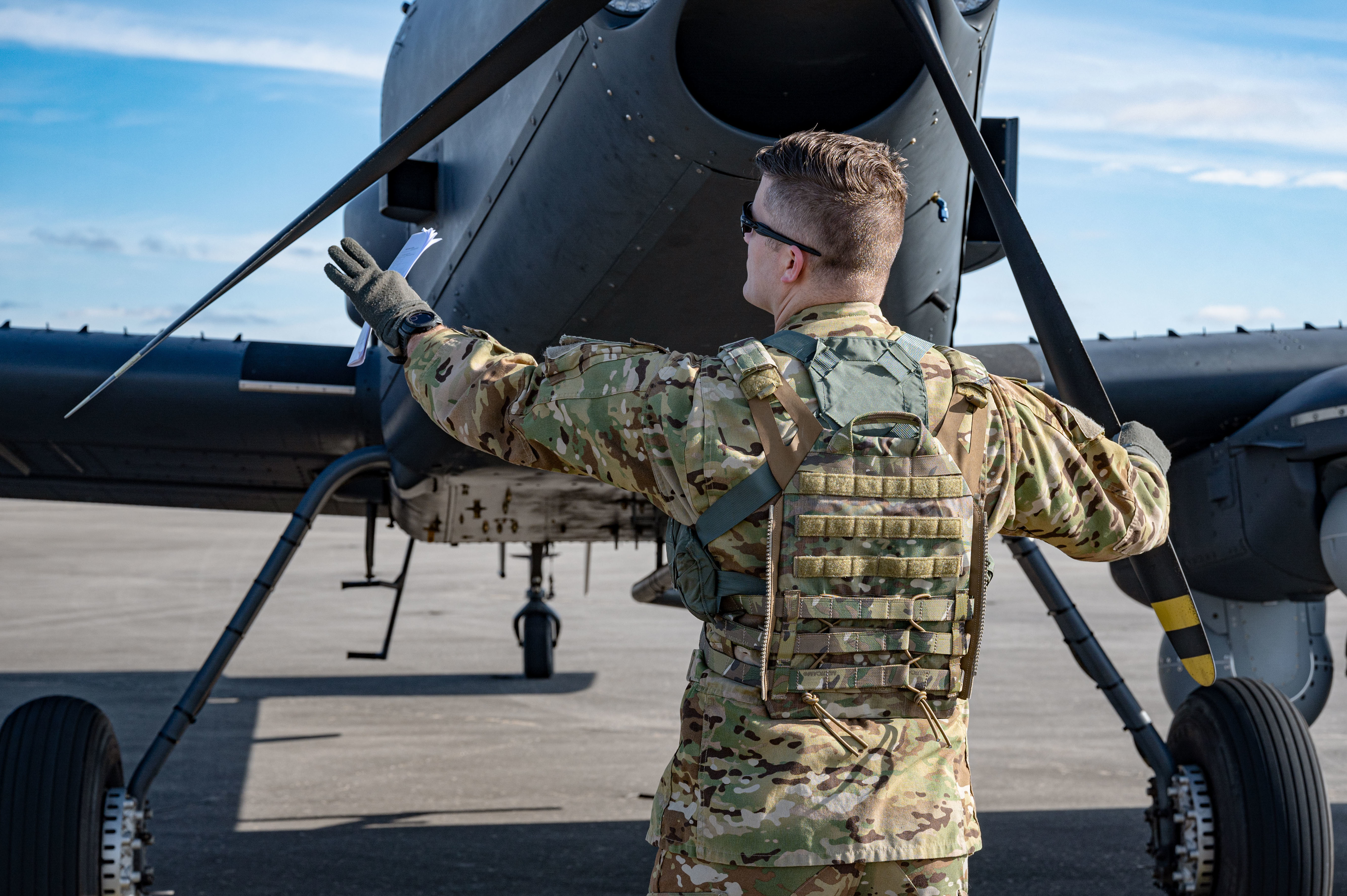 An OA-1K Skyraider II pilot conducts a walkaround on the flightline at Hurlburt Field, Florida, Jan. 28, 2025. The OA-1K Skyraider II will deliver close air support, precision strike, and armed intelligence, surveillance and reconnaissance capabilities. (U.S. Air Force photo by Staff Sgt. Natalie Fiorilli)