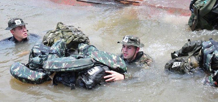 New York Air National Guard Senior Airman Caleb Lapinel trains on tactical swimming in a Brazilian river in October 2020 while attending the international course conducted annually by the Brazil Jungle Warfare Center, known as CIGS for its Portugese initials. Lapinel was the only American in the class of ten.( Courtesy Photo)