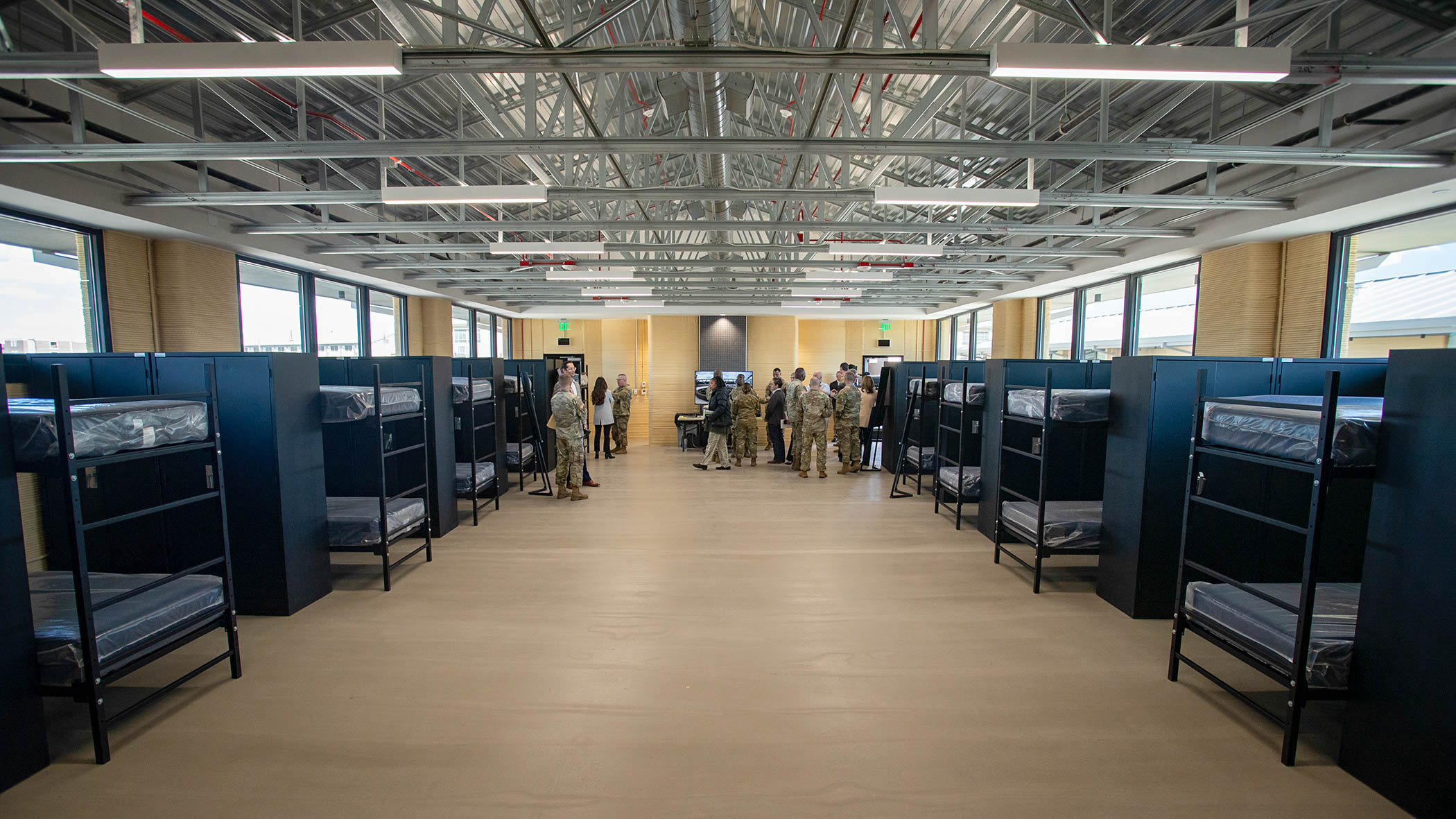 Army leaders, stakeholders and guests tour one of three new 3D-printed barracks at Fort Bliss, Texas, Jan. 29, 2025. According to ICON, an Austin, Texas, company that spearheaded the project, the buildings each encompass 5,700 square feet. When construction began in 2024, these barracks were the largest planned 3D-printed structures in the Western Hemisphere.