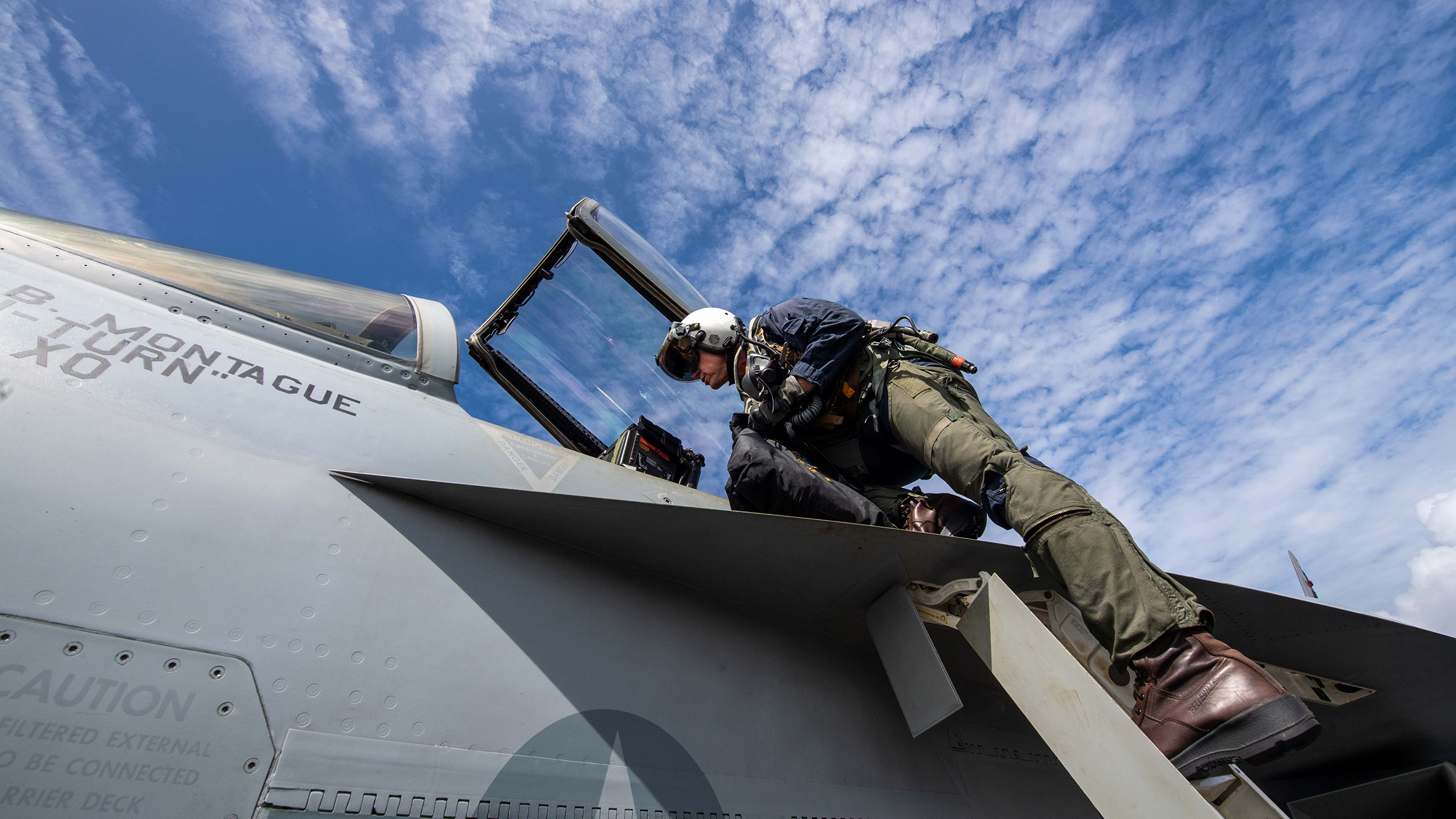 250216-N-FS097-1096 PHILIPPINE SEA (Feb. 16. 2025) Rear Adm. Michael Wosje, commander of Carrier Strike Group ONE, climbs into the cockpit of an F/A-18E Super Hornet, assigned to the “Stingers” of Strike Fighter Squadron (VFA) 113, before his 1,000th trap on the flight deck of the Nimitz-class aircraft carrier USS Carl Vinson (CVN 70) in the Philippine Sea during Pacific Steller 2025, Feb. 16. The 1,000th trap is a milestone in any senior aviator’s career. Pacific Steller 2025 is a multi-large deck event with the Carl Vinson Carrier Strike Group, French Carrier Strike Group, and Japan Maritime Self-Defense Force, fostering our alliances and maritime security in support of a secure and prosperous Indo-Pacific. (U.S. Navy photo by Mass Communication Specialist 3rd Class Nate Jordan)