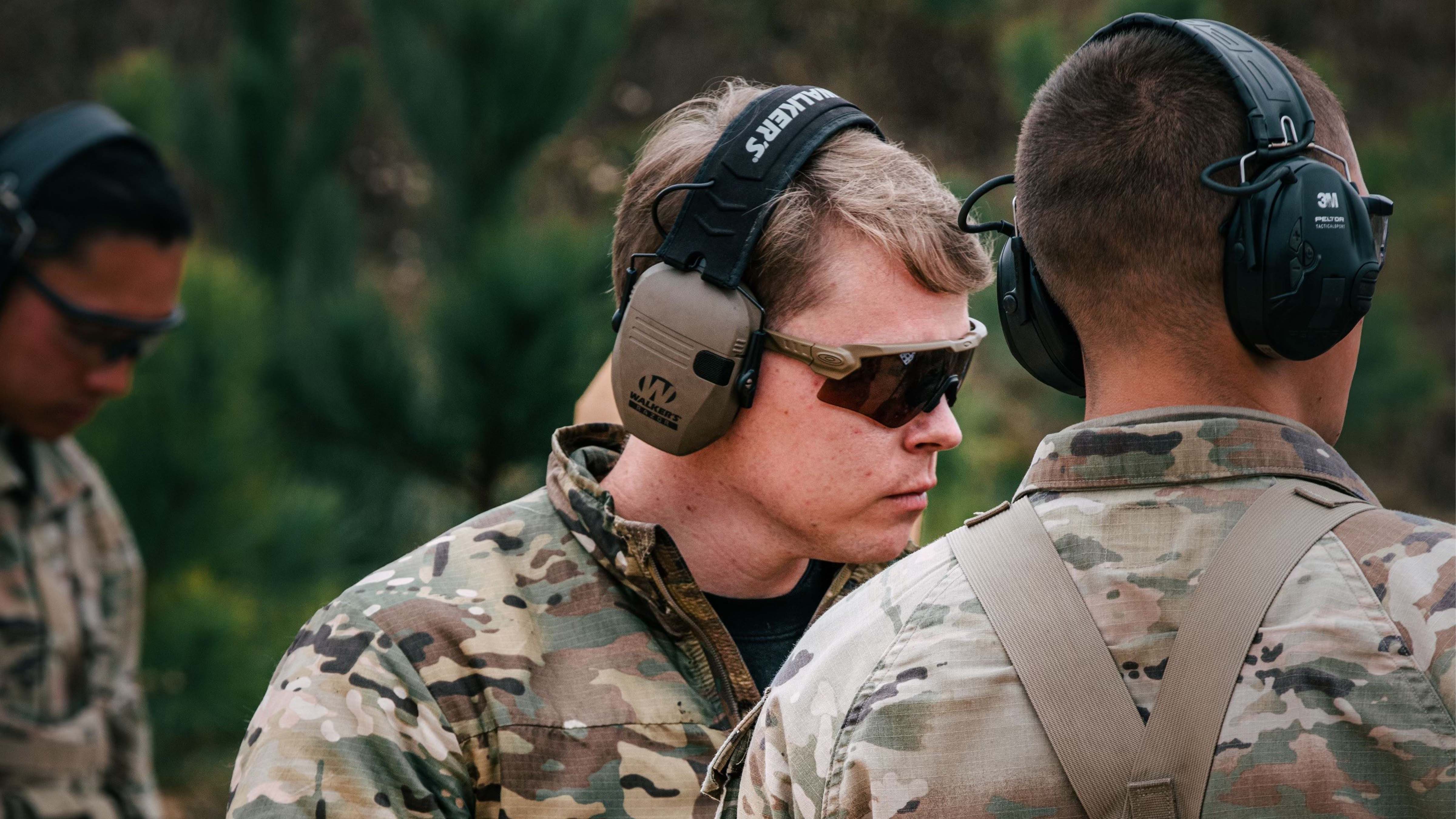 Staff Sgt. Zachary Hargrove, a cadre member with the Ranger Assessment and Selection Program provides marksmanship instruction to a Ranger candidate at Fort Moore, Georgia