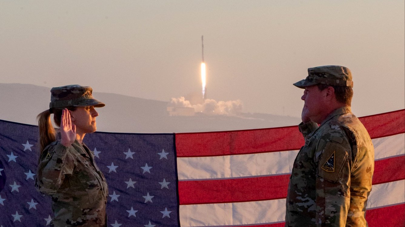 Airman reenlists as SpaceX Falcon 9 rocket blasts into space