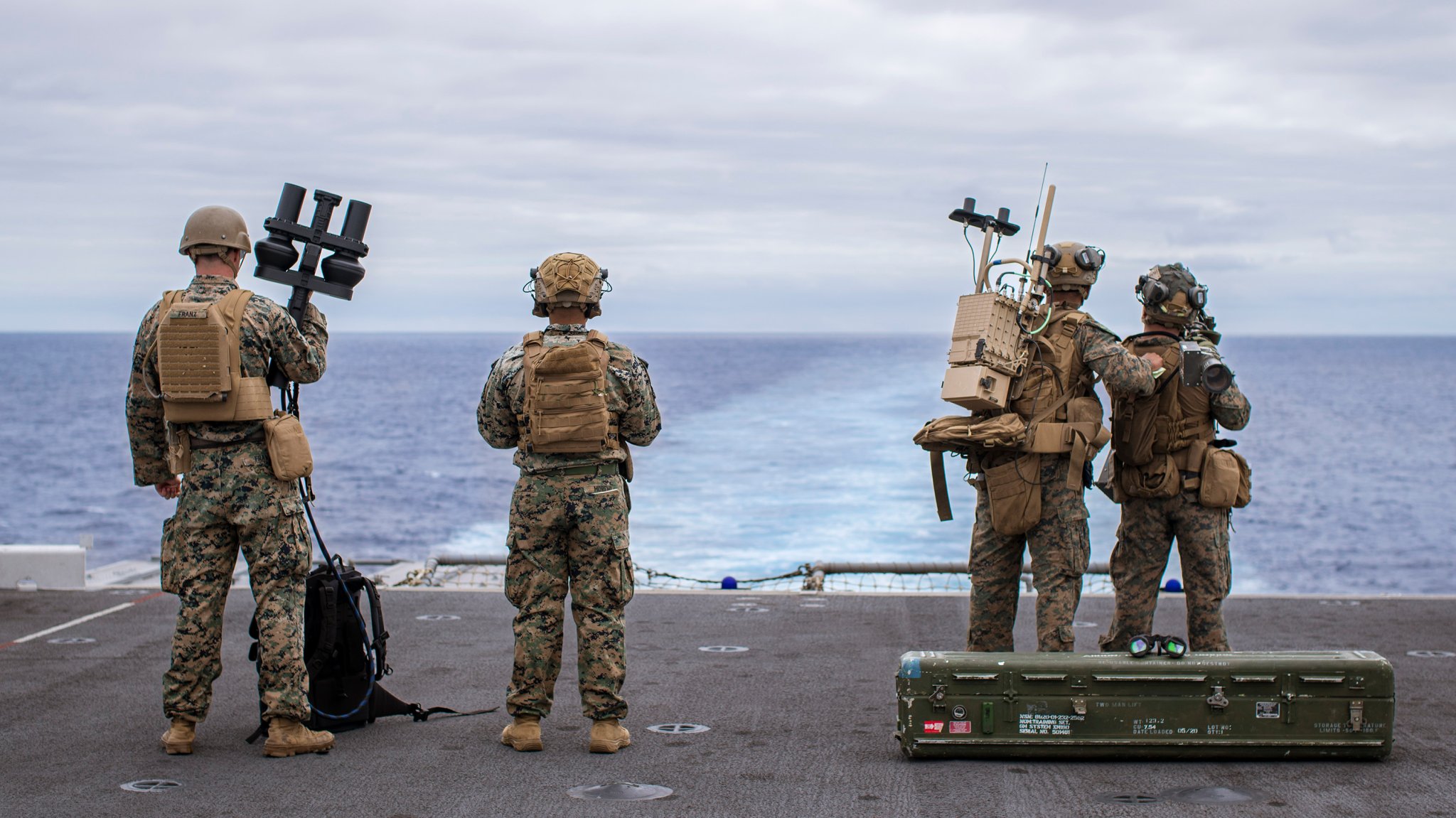 U.S. Marines assigned to Battalion Landing Team 1/5, 15th Marine Expeditionary Unit, and Marine Medium Tiltrotor Squadron (VMM) 165 (Reinforced), 15th MEU, scan for simulated threats from the amphibious assault ship USS Boxer (LHD 4) with a NightFighter S portable counter-unmanned aerial vehicle system, a MODI II system, and an FIM-92 Stinger during a counter-unmanned aircraft system drill in the Pacific Ocean July 20, 2024. Elements of the 15th MEU are currently embarked aboard the Boxer Amphibious Ready Group conducting routine operations in U.S. 3rd Fleet. (U.S. Marine Corps photo by Cpl. Amelia Kang)