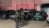 Uniformed police and Drug Enforcement Agency agents stand outside a nightclub.