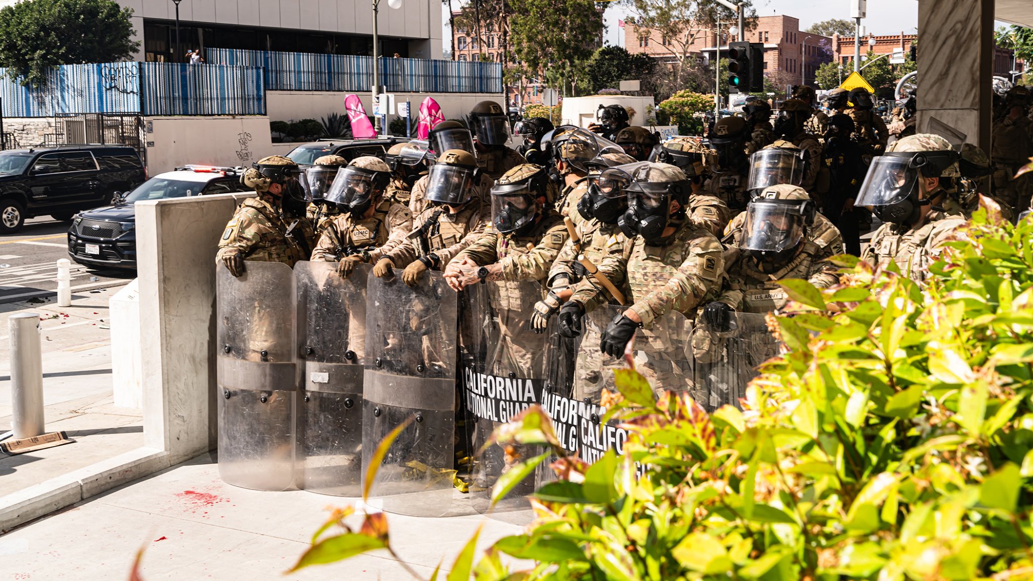 U.S. Soldiers assigned to 1st Battalion, 185th Infantry Regiment, 79th Infantry Brigade Combat Team under Title 10 authority and U.S. Marines assigned to 2nd Battalion, 7th Marines,1st Marine Division, provide protection to federal functions, property, and law enforcement personnel in Los Angeles, June 14, 2025. U.S. Northern Command is supporting federal agencies by providing military forces to protect federal functions, personnel, and property in the greater Los Angeles area. On June 7, the Secretary of Defense directed USNORTHCOM to establish Task Force 51 to oversee Title 10 forces supporting this mission. (U.S. Army photo by Sgt. Chase Murray)