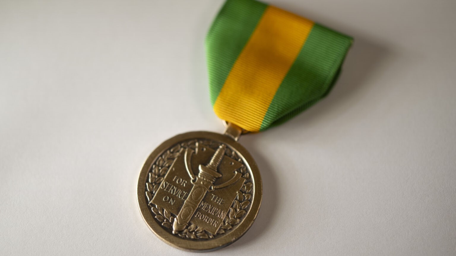 The new Mexican Border Defense Medal, with a green and yellow ribbon.