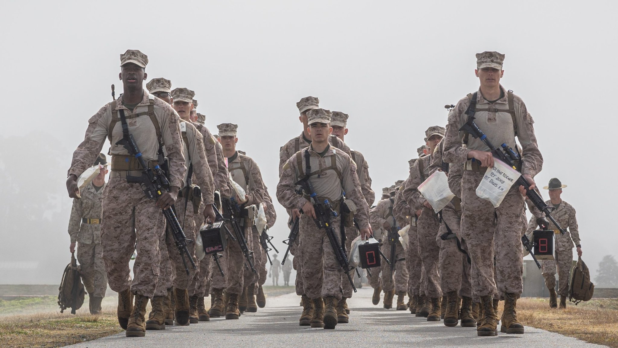Recruits with Fox Company, 2nd Recruit Training Battalion, march to the firing line during the Entry Level Rifle Qualification on Marine Corps Recruit Depot Parris Island, S.C., Feb. 3, 2025. During qualification, recruits are tested on their knowledge of the fundamentals of marksmanship. (U.S. Marine Corps photo by Lance Cpl. Ayden Cassano)