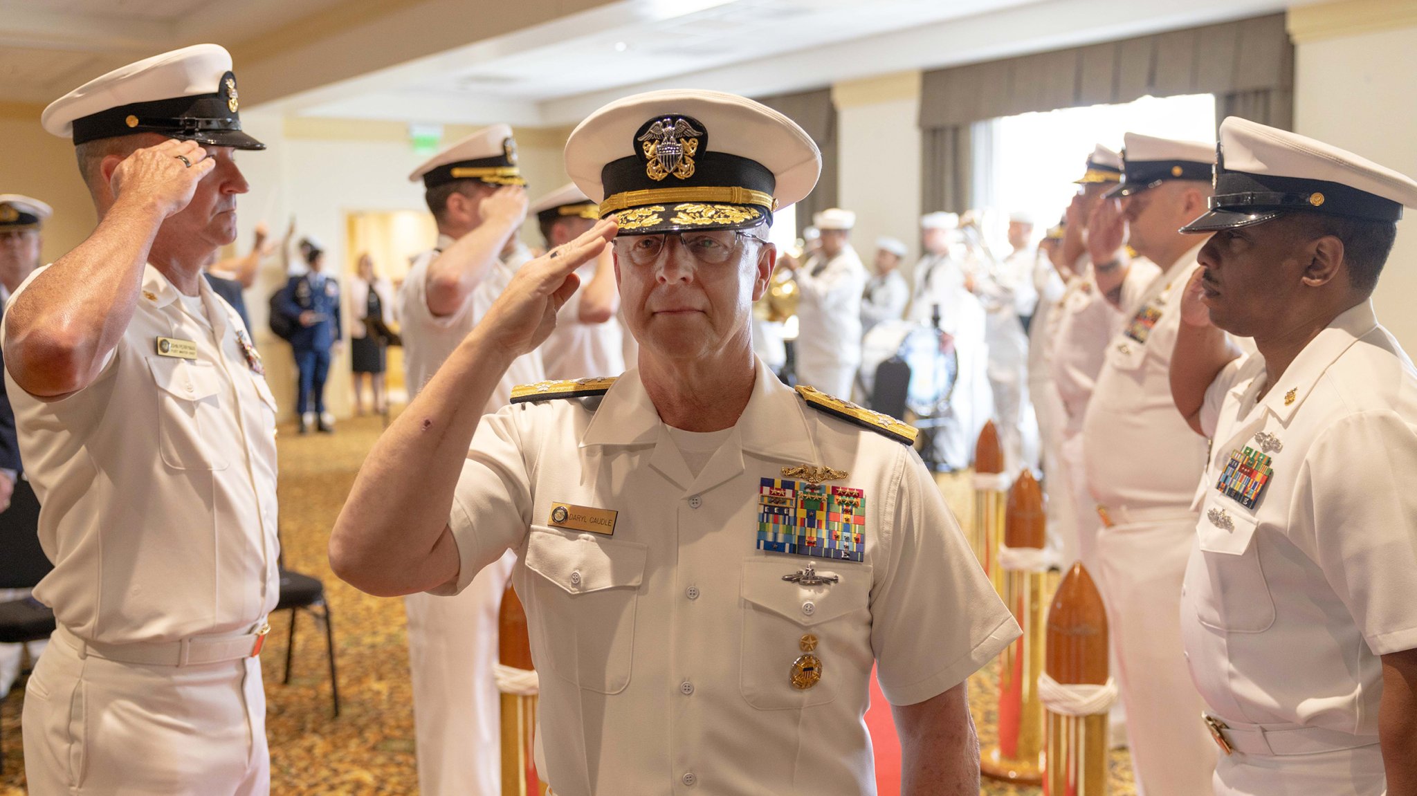 Adm. Daryl Caudle salutes the sideboys during a U.S. Fleet Forces Command (USFFC) Relinquishment of Command ceremony aboard Naval Station Norfolk, August 6, 2025. USFFC is responsible for manning, training, equipping and providing combat-ready forces forward to numbered fleets and combatant commanders around the globe. (U.S. Navy photo by Mass Communication Specialist 2nd Class Dustin Knight/Released)