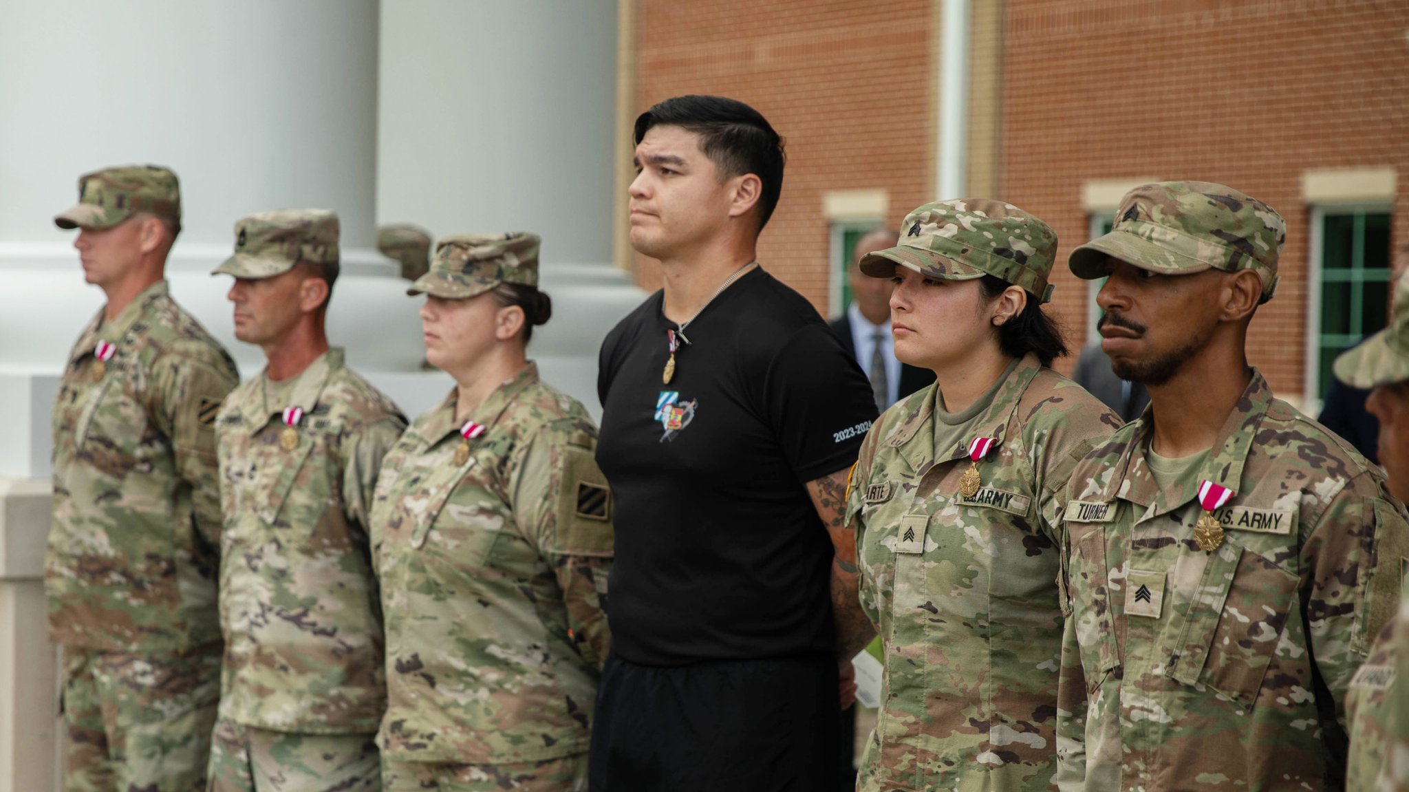 Secretary of the Army, Hon. Daniel P. Driscoll pins a medal on a Soldier recognized for valor during the Aug. 6 active shooter incident at Fort Stewart, Aug. 7, 2025. Multiple Soldiers tackled and subdued the assailant, minimizing casualties. (U.S. Army photo Sgt. Bernabe Lopez)