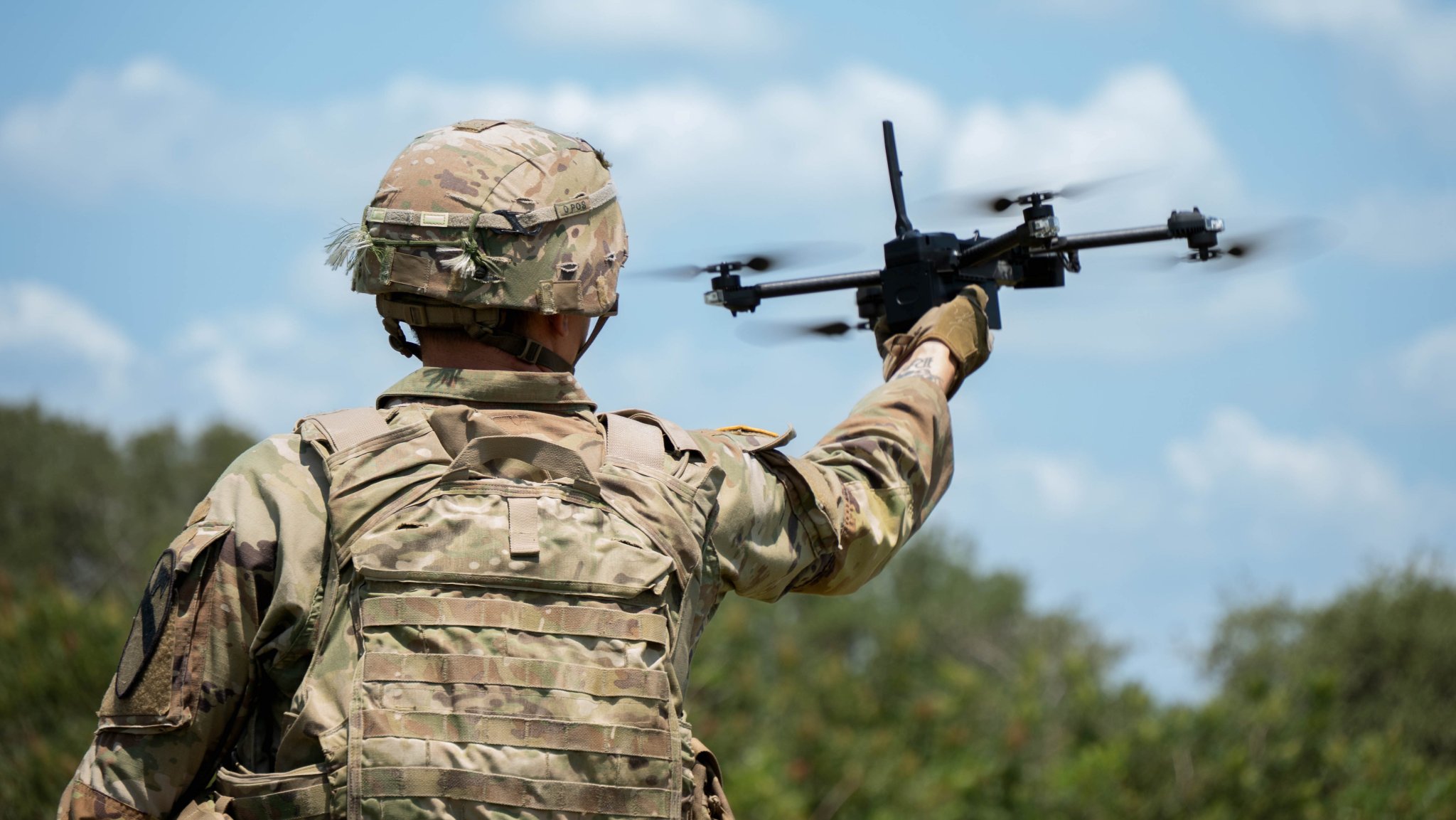 1st Cavalry Division Trooper, Sgt. Nathaniel Martin, an Unmanned Aircraft System Operator, assigned to 8th Brigade Engineer Battalion, 2nd Armored Brigade Combat Team, launches a drone from his hand during Pegasus Forge, on Fort Hood, Texas, Aug. 6, 2025. Pegasus Forge allows the First Team to utilize new technology and gain experience in the field to support and progress in the Army's Transformation in Contact initiative. (U.S. Army Photo by Spc. David Dumas)