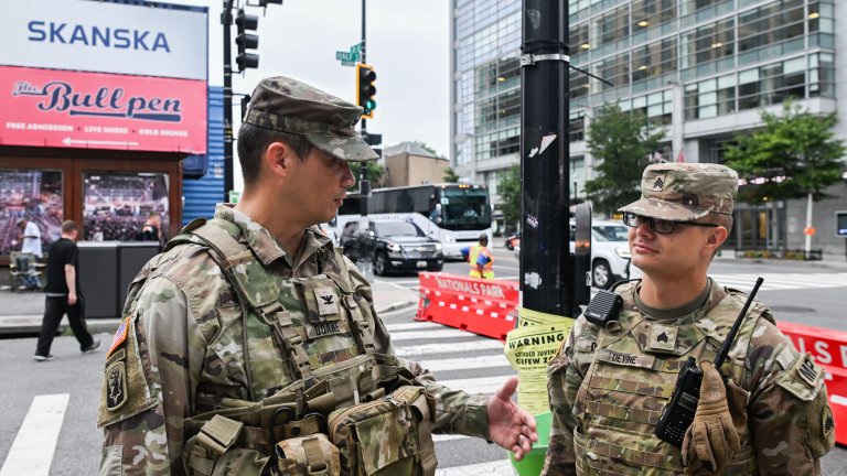 U.S. Army Col. Lawrence Doane, DC Safe and Beautiful Taskforce Commander, engages with U.S. Service Members assigned to JTF-DC and Civilians at Nationals Park in Washington D.C., August 19, 2025. Approximately 800 National Guard service members comprise JTF-DC to support the DC Safe and Beautiful Taskforce. These National Guard service members provide critical support such as crowd management, perimeter control, logistics and communications in support of law enforcement. A majority of the D.C. National Guard personnel live and work in the local community and have existing relationships to support law enforcement. (U.S. Army photo by Sgt. Joseph Spraktes)