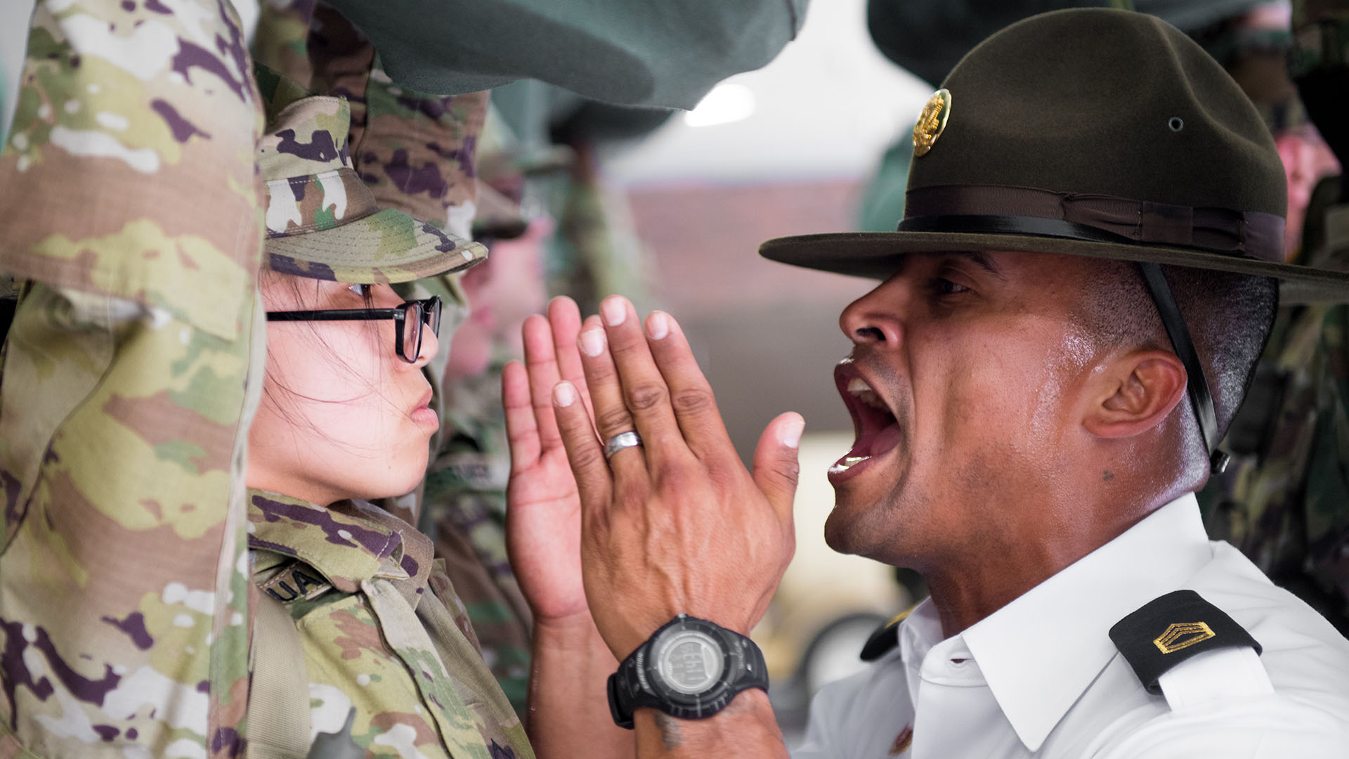 U.S. Army Drill Sergeant Sgt 1st Class. Aleman assigned to Foxtrot 1st Battalion 34th Infantry Regiment participates in the “Shark Attack” or fear stage of the discipline process, as trainees arrive to the First day of Basic Combat Training on 12 June 2017 at Fort Jackson, SC. Among those assigned to the 1st Battalion, 34th Infantry Regiment are Reserve Drill Sergeants from the 3rd Battalion, 518th Infantry Regiment who are required to serve two weeks for annual training (U.S. Army photo by Spc. Darius Davis/Released).