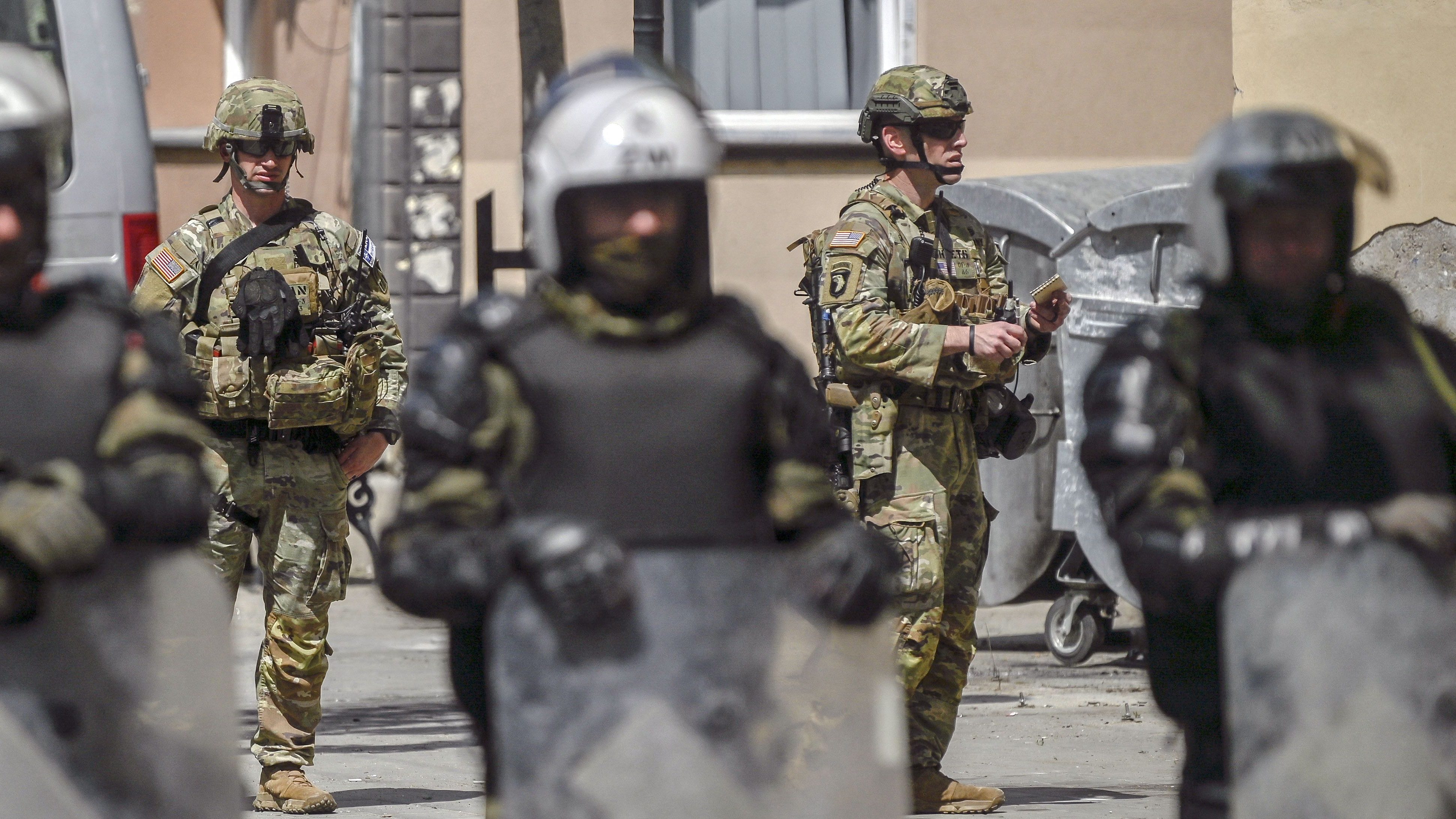 NATO soldiers and International military police secure the area near Zvecan, northern Kosovo on May 30, 2023, a day following clashes with Serb protesters demanding the removal of recently elected Albanian mayors. The situation in northern Kosovo remained tense on May 30, 2023, as ethnic Serbs continued to gather in front of a town hall in Zvecan after violent clashes with NATO-led peacekeepers left 30 soldiers injured. (Photo by Armend NIMANI / AFP) (Photo by ARMEND NIMANI/AFP via Getty Images)