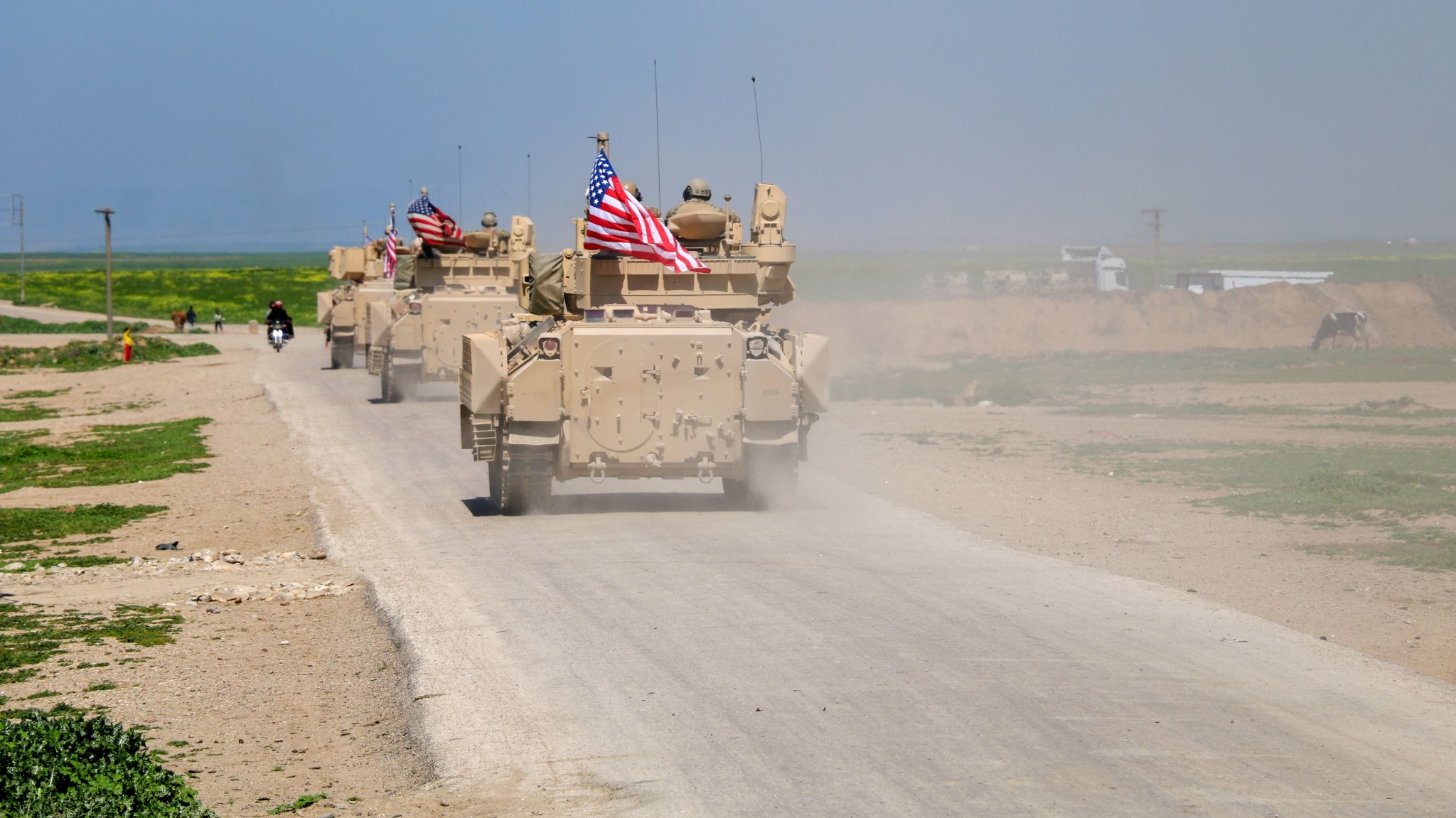 DEIR EZ-ZOR, SYRIA - AUGUST 13: Military vehicles that the US military sent as a reinforcement, convoy to the bases controlled by PKK/YPG (PKK listed as a terrorist organization by Turkiye, the U.S. and the EU and YPG which Turkiye consider as the extension of PKK in Syria) in Deir ez-Zor province in Syria, on August 13, 2023. (Photo by Omer Al Diri/Anadolu Agency via Getty Images)