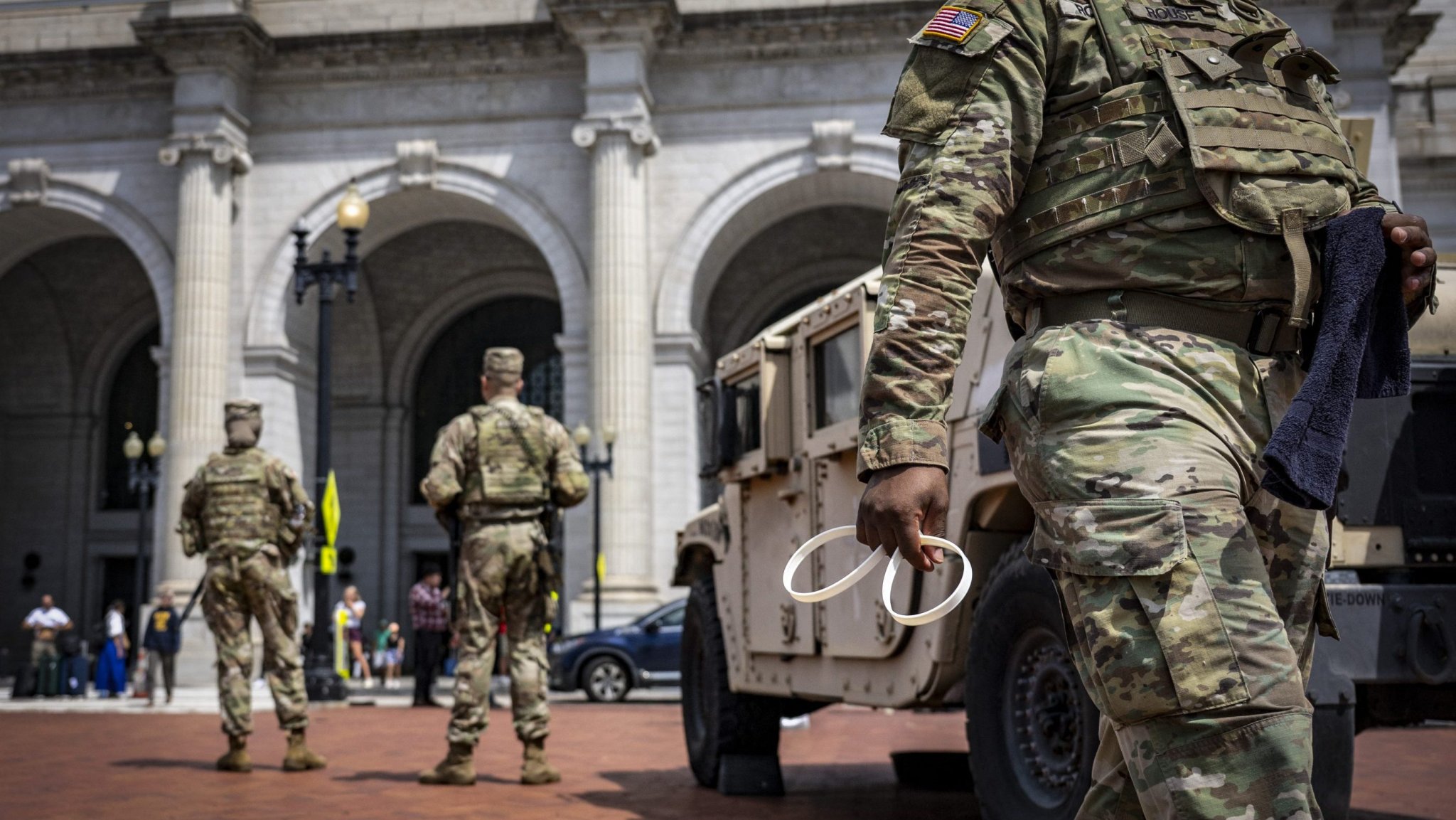Members of the US National Guard patrol at Union Station in Washington, DC, on August 14, 2025. US President Donald Trump on August 11 deployed military and federal law enforcement to curb violent crime in Washington, as he seeks to make good on his campaign pledge to be a "law and order" president. The Republican leader said he would place the city's Metropolitan Police under federal government control while also sending the National Guard onto the streets of the US capital. (Photo by Jim WATSON / AFP) (Photo by JIM WATSON/AFP via Getty Images)