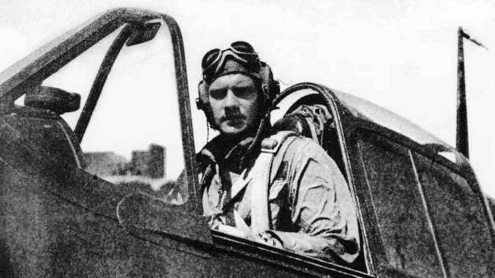 Navy aviator Donald McPherson sits inside his Grumman F6F Hellcat fighter during World War II.