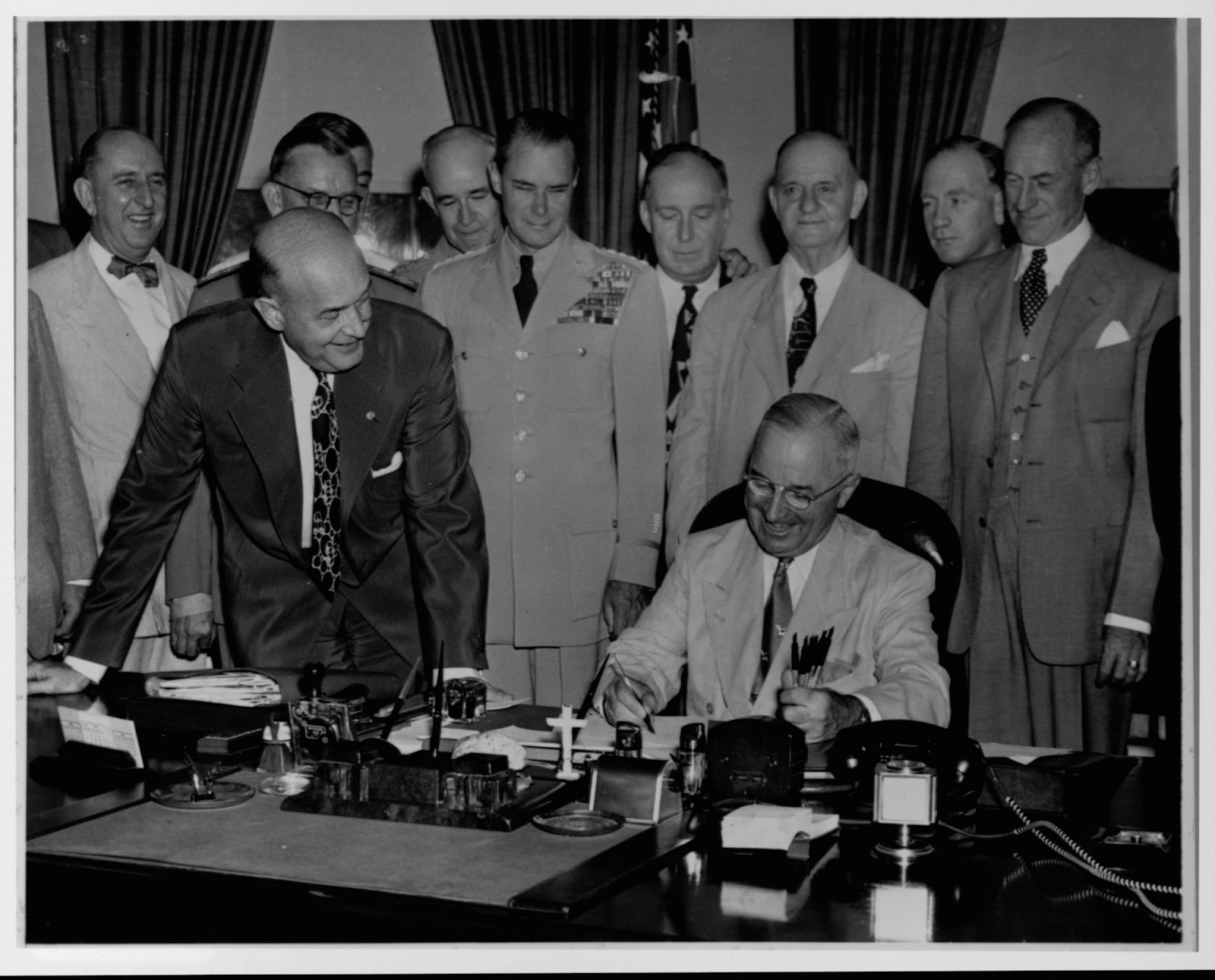 President Harry S. Truman signing the Unification Bill, which created the Department of Defense. Photo by Library of Congress/Corbis/VCG via Getty Images.