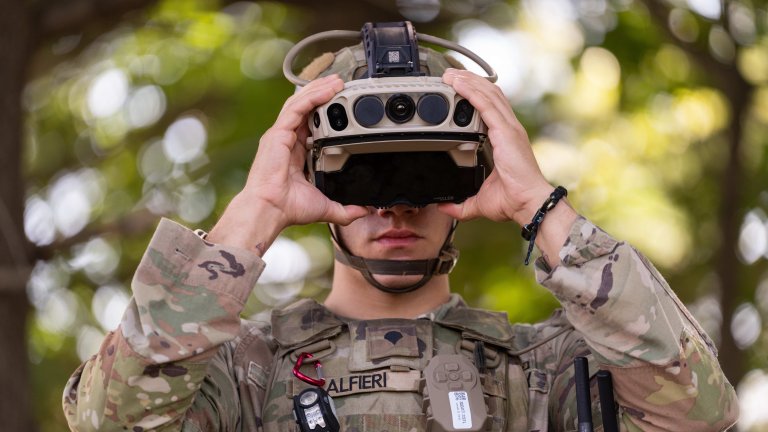 Spc. Layne Alfieri, a Soldier assigned to 1st Battalion 87th Infantry Regiment, 1st Infantry Brigade Combat Team, 10th Mountain Division, dons an Integrated Visual Augmentation System (IVAS) 1.2 protype during the IVAS 1.2 Phase One User Assessment held by Program Executive Office (PEO) Soldier on Fort Drum, August 22. The user assessment was designed to collect Soldier feedback on the IVAS 1.2 prototypes. (U.S. Army photo by Jason Amadi, PEO Soldier Public Affairs)