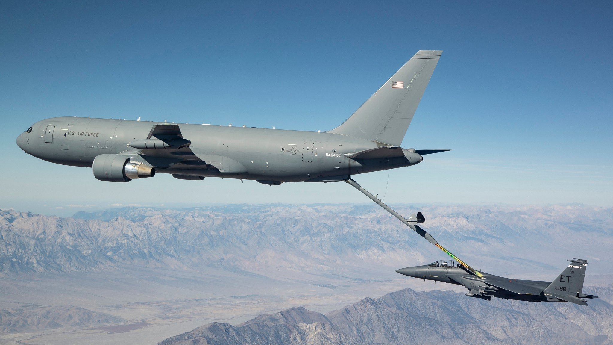 A new KC-46A Pegasus connects with an F-15 Strike Eagle for an aerial refueling test over California in 2018. (Courtesy photo by John D. Parker/Boeing)