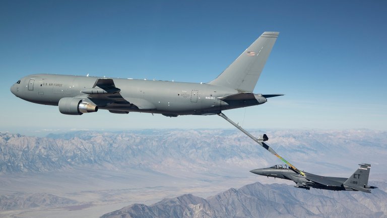 A new KC-46A Pegasus connects with an F-15 Strike Eagle for an aerial refueling test over California in 2018. (Courtesy photo by John D. Parker/Boeing)