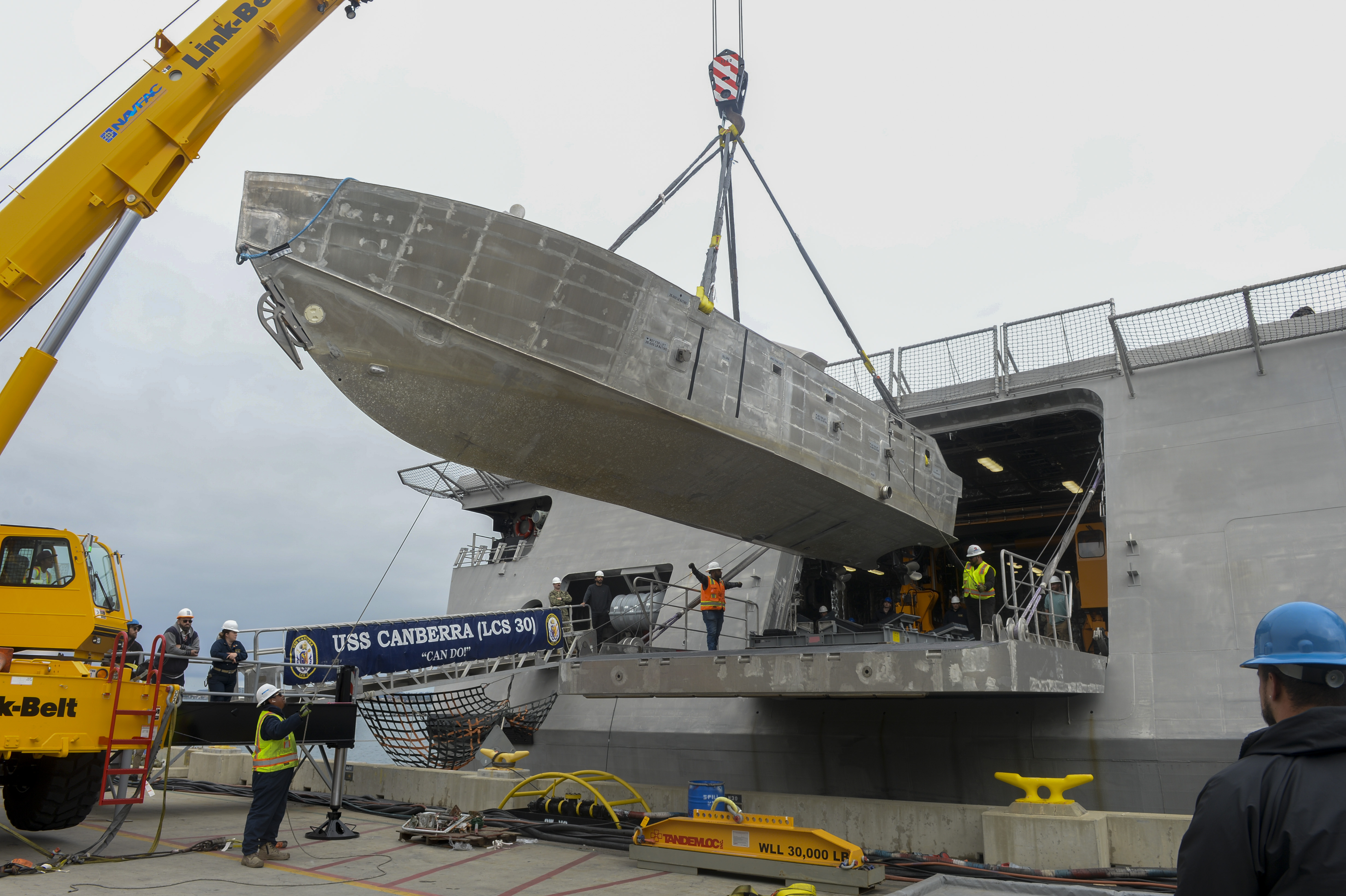 An unmanned surface vehicle is craned aboard the Independence-variant littoral combat ship USS Canberra (LCS 30), as a part of the first embarkation of the Mine Countermeasures (MCM) mission package, April 23. The MCM mission package is an integrated suite of unmanned maritime systems and sensors which locates, identifies, and destroys mines in the littorals while increasing the ship’s standoff distance from the threat area. Littoral Combat Ships are fast, optimally-manned, mission-tailored surface combatants that operate in near-shore and open-ocean environments, winning against 21st-century coastal threats. (U.S. Navy photo by Mass Communication Specialist 1st Class Vance Hand)