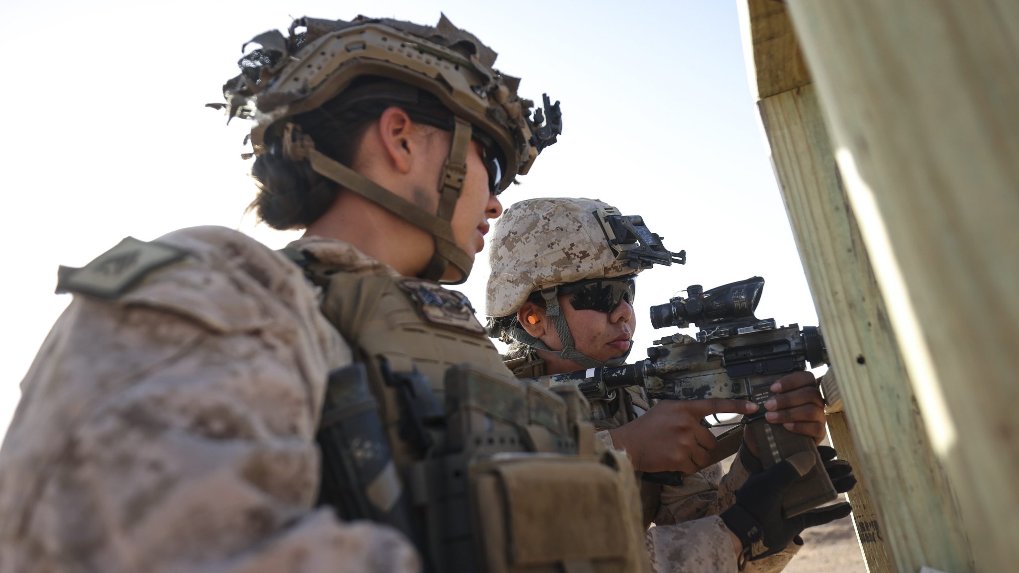 U.S. Marine Corps Sgt. Brianna Eisenhower, left, a combat marksmanship trainer assigned to Weapons and Field Training Battalion, Marine Corps Recruit Depot San Diego, corrects a shooter’s position in preparation for an all-female marksmanship subject matter expert exchange between U.S. Marines and Jordanian Soldiers during Intrepid Maven 25.1 in Al-Quwayrah, Jordan, Oct. 26, 2024. The second iteration of this exchange between U.S. and Jordanian female engagement teams was nested in Intrepid Maven 25.1 and represents a step forward in strengthening military cooperation and promoting Women, Peace, and Security initiatives. (U.S. Marine Corps photo by Sgt. Angela Wilcox)