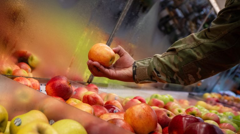 U.S. Air Force Senior Airman Serafin Lemus-Magana, 6th Operational Medical Readiness Squadron food sanitation and safety program manager, inspects fruit at the commissary on MacDill Air Force Base, Florida, Dec. 27, 2024. Lemus-Magana is the one of two personnel at MacDill AFB responsible for inspecting 68 facilities across the installation. Inspections are targeted towards proactively identifying and addressing food-borne illnesses before reaching the community. (U.S. Air Force photo by Senior Airman Zachary Foster)