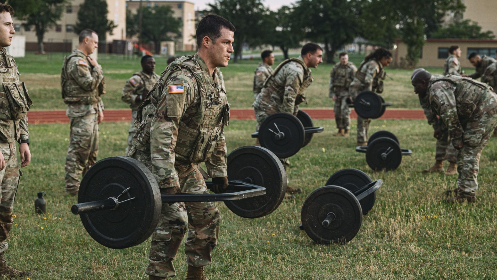 Soldiers assigned to Headquarters and Headquarters Battery, 75th Field Artillery Brigade, participated in the "Sweat More, Bleed Less" physical fitness event in Fort Sill, Oklahoma, June 11, 2025. The event had Soldiers conducting hundreds of pullups, pushups, squats, and deadlifts, as well as running a mile all in their issued body armor. (U.S. Army photo by Sgt. Christian Carrillo)