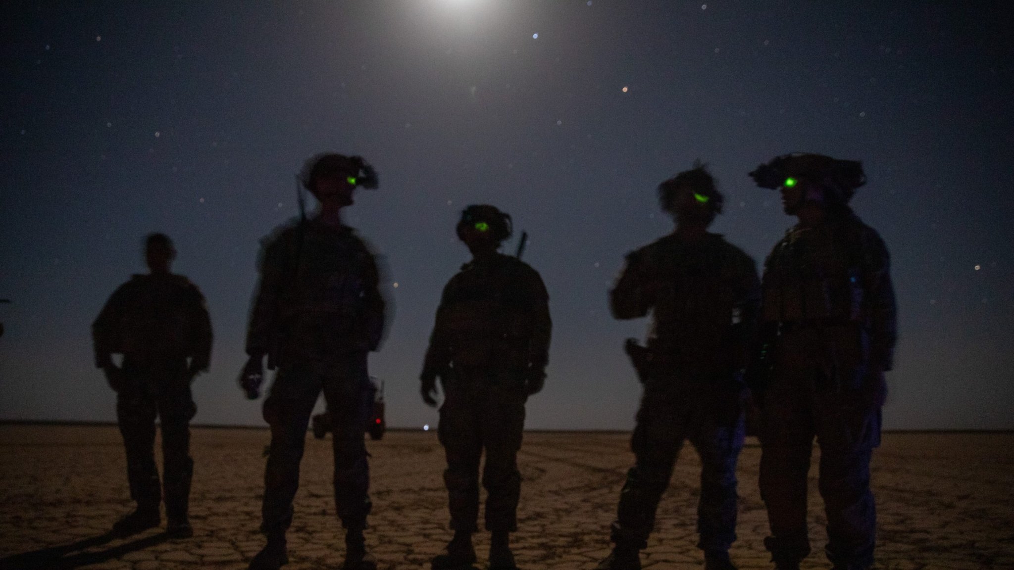 U.S. Army Infantrymen, assigned to 10th Mountain Division, Task Force ARMADILLO, oversee M240B machine gun training in Syria, June 2, 2025. Night range operations provide a tactical advantage over adversaries, enhancing operational and soldier readiness. The Coalition is committed to building partner capacity and capabilities in order to maintain the lasting defeat of ISIS. (U.S. Army photo by Sgt. Trenton Pallone)