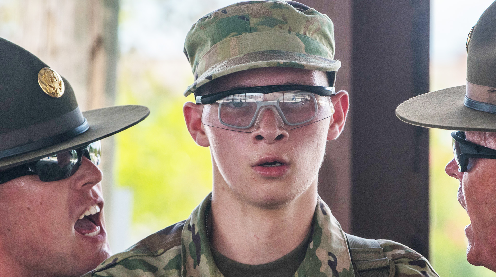 New soldiers arriving for their first day of Basic Combat Training at Fort Jackson, South Carolina being greeted by drill sergeants.