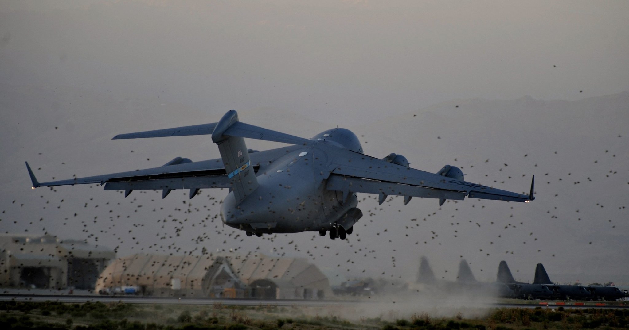 A US Air Force C-17 heavy lifter takes off from Bagram AirBase, in the Parwan province some 50kms north of Kabul, on August 10, 2009. The top US military commander in Afghanistan says the Taliban have gained the upper hand in the country, forcing the United States to change its strategy by increasing the number of troops in heavily populated areas, The Wall Street Journal reported. AFP PHOTO/ MANAN VATSYAYANA (Photo by MANAN VATSYAYANA / AFP) (Photo by MANAN VATSYAYANA/AFP via Getty Images)