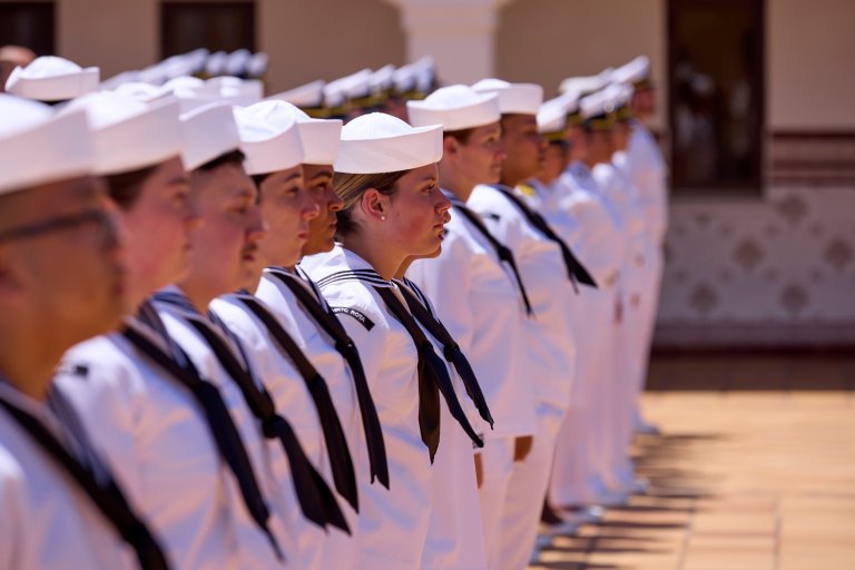 250522-N-FT324-8920. ROTA, SPAIN (May 22, 2025). Sailors from Navy Medicine Readiness and Training Command stand in formation during the summer whites uniform inspection demonstrating pride and professionalism in their appearance and readiness. (U.S. Navy Photo by Mr. Everett Lopez/ Released by Lt. Cmdr. Alicia Sacks)