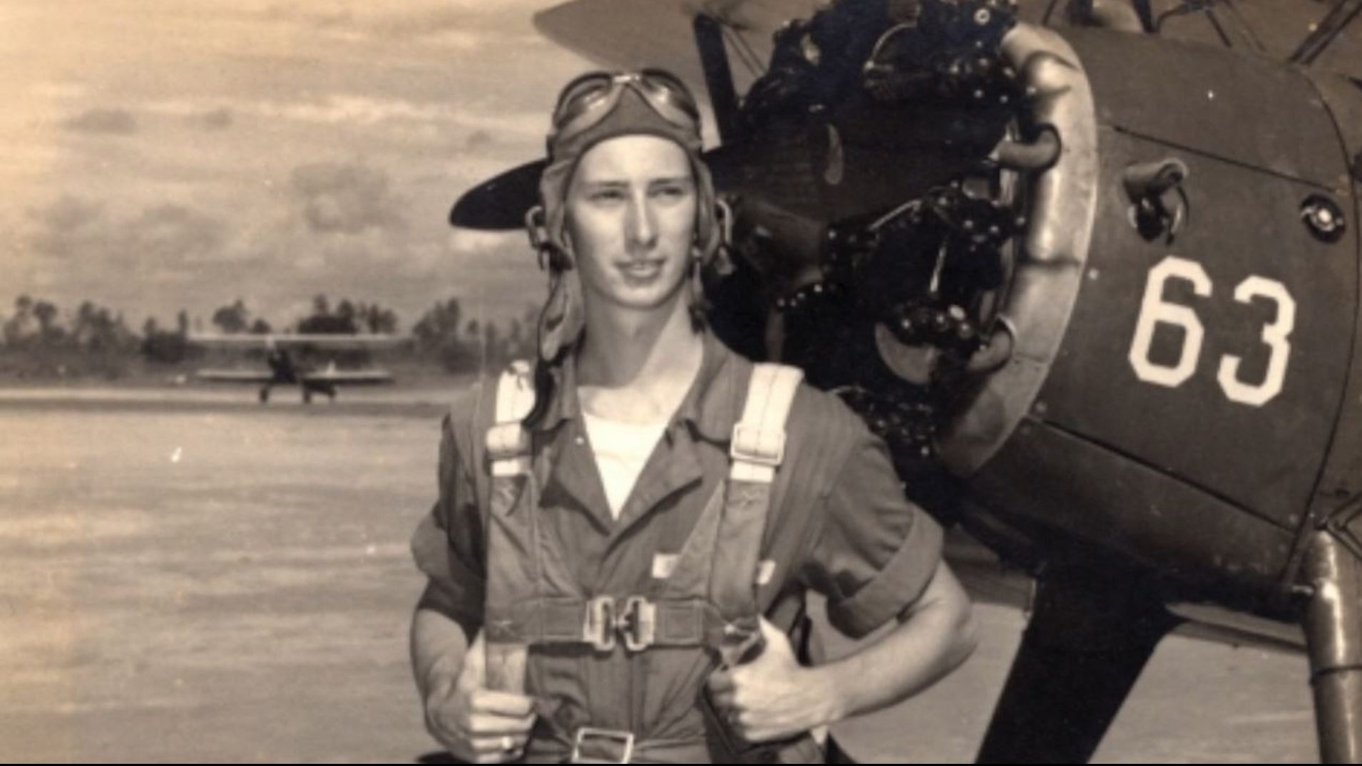 John "Lucky" Luckadoo near a B-17 in World War II.