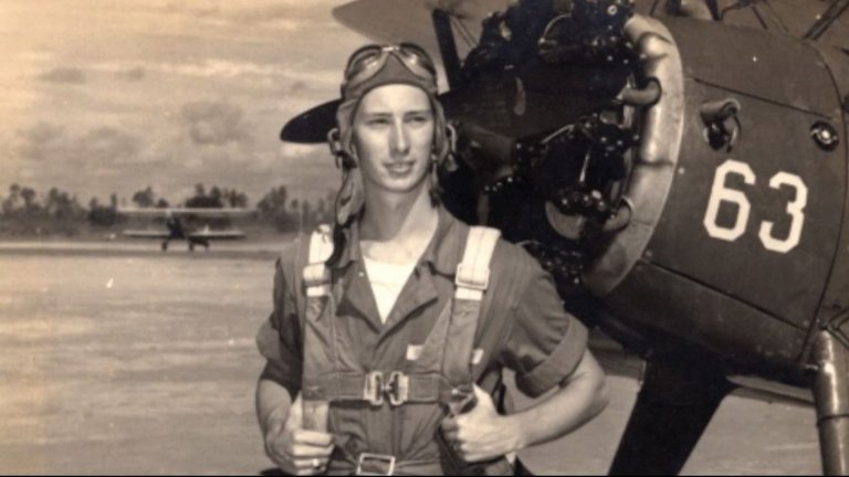 John "Lucky" Luckadoo near a B-17 in World War II.